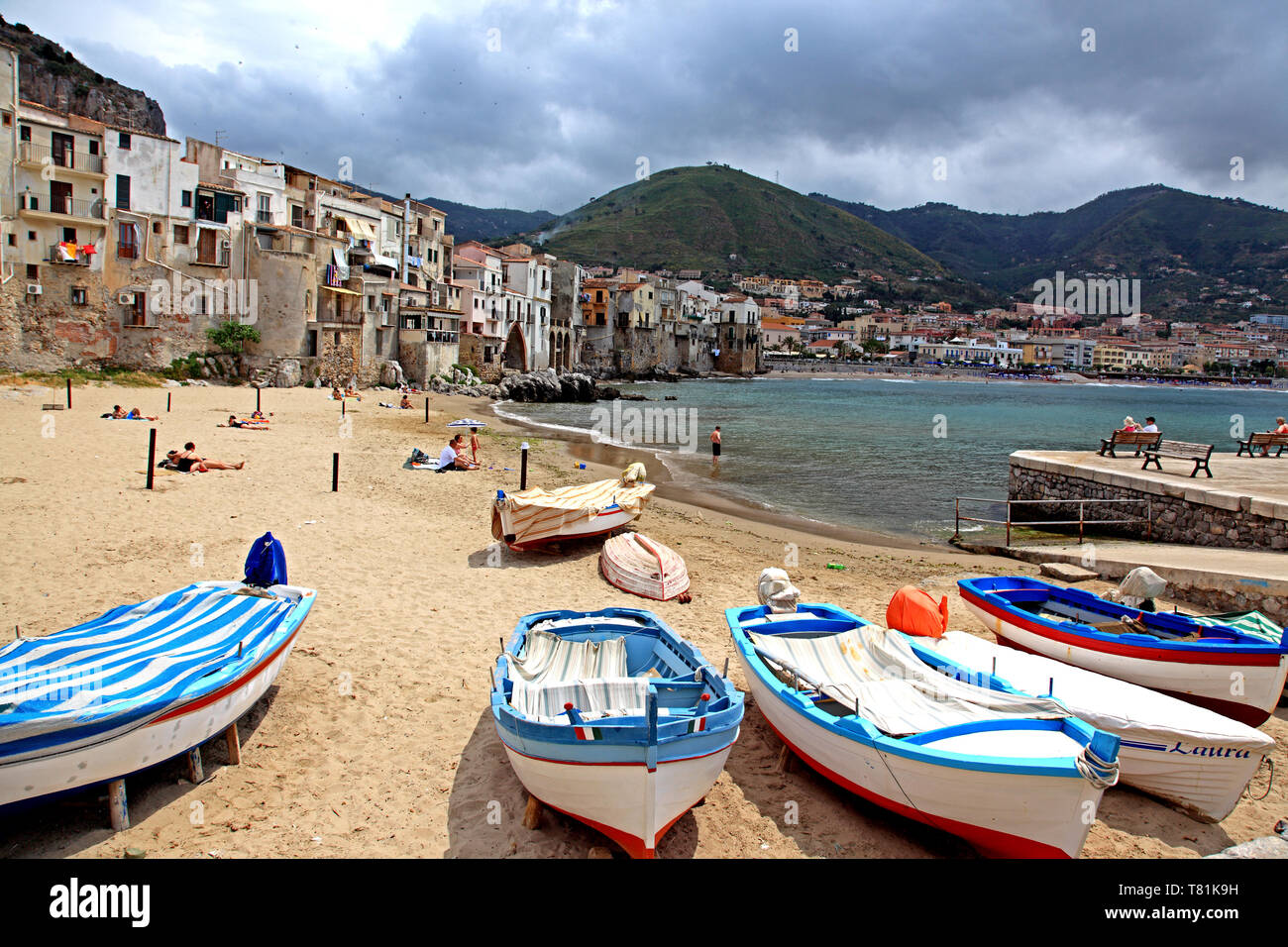 Boats and beach in Cefalu in Sicily Italy Stock Photo
