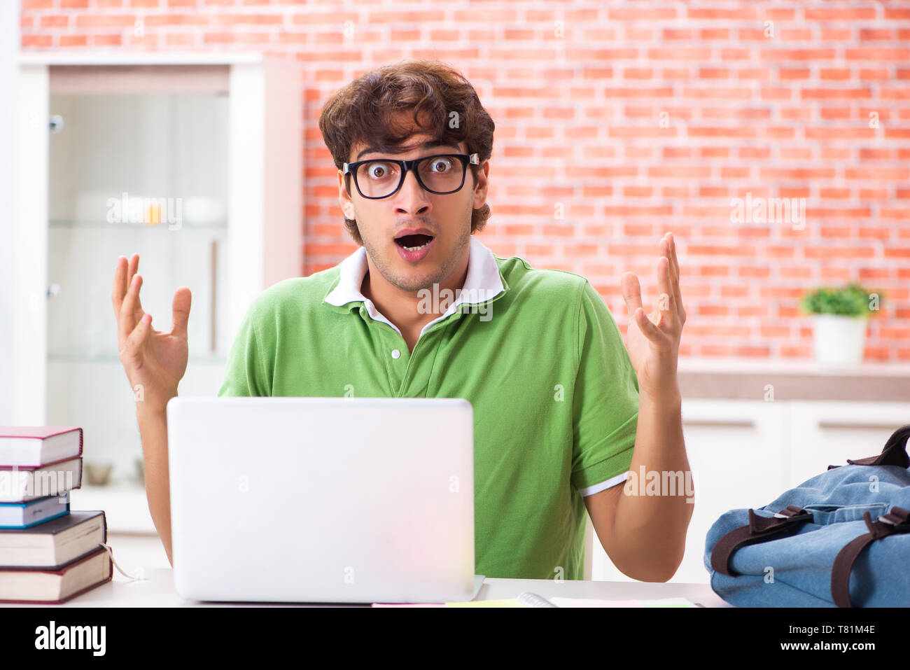 Young student preparing for exams at home Stock Photo - Alamy