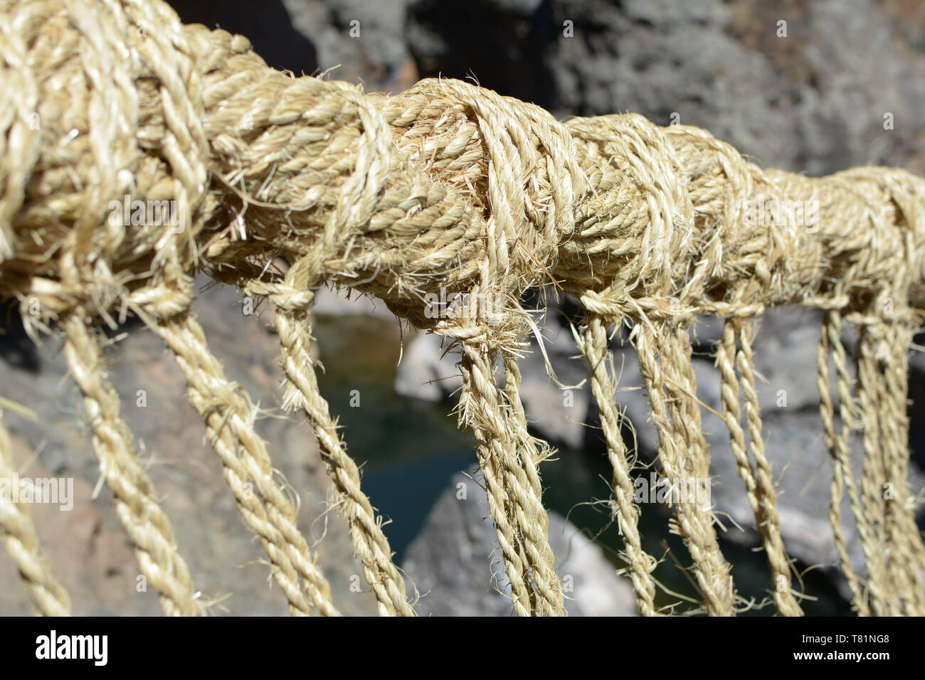 Ancient rustic bulrush sedge suspension bridge Stock Photo