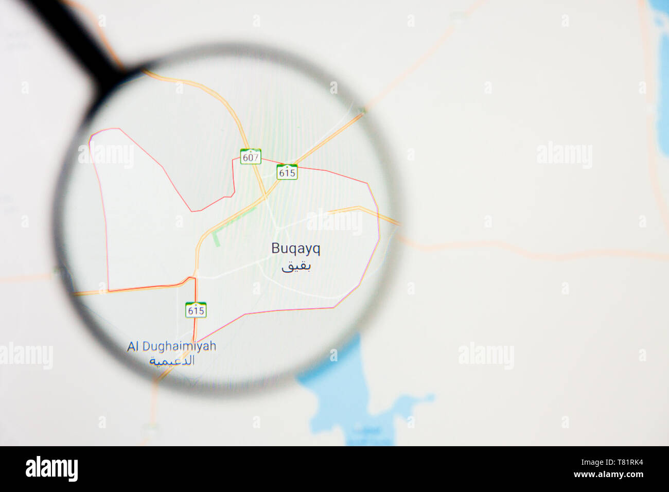 Abqaiq city in Saudi Arabia visualization illustrative concept on screen through magnifying glass Stock Photo