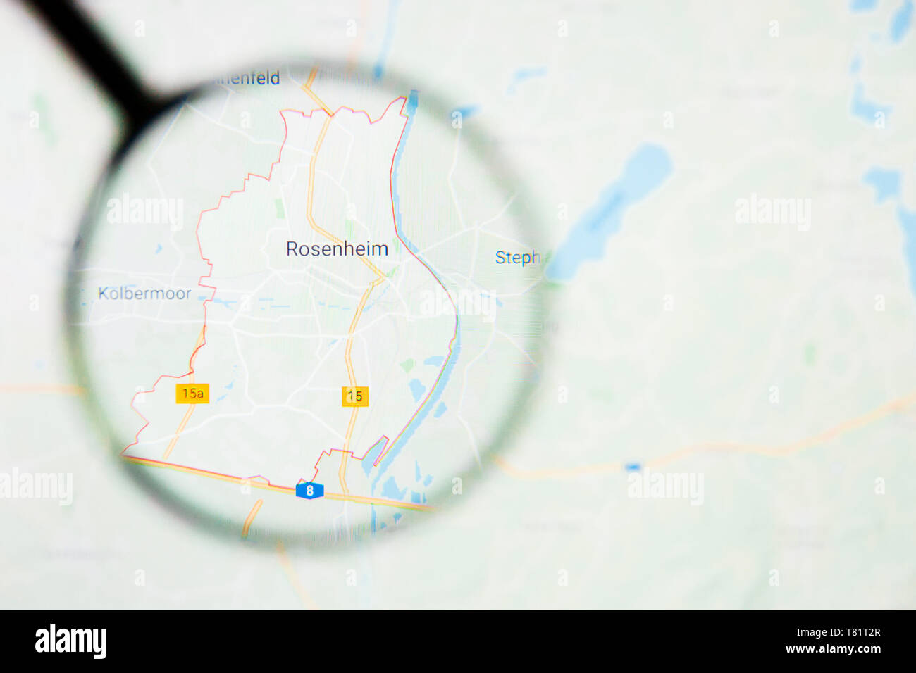 Rosenheim city in Germany, Bavaria visualization illustrative concept on screen through magnifying glass Stock Photo