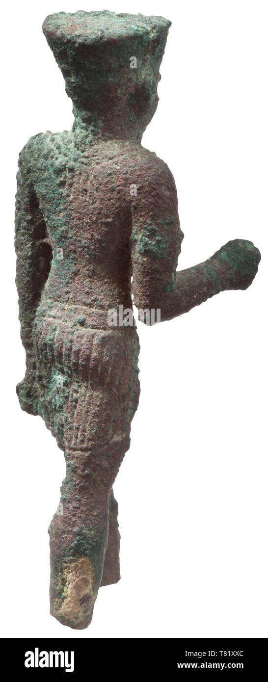 An Egyptian statuette of Amun or Amun-Re, Late Period, circa 600 BC Bronze with encrusted, green patina. The god in striding posture. Parts of the feather headdress, of the sceptre and of the crux ansata missing. Some parts with minimal remnants of a gilding. Height 9 cm. Provenance: Private collection Paris, acquired during the 1970s/1980s. historic, historical, ancient world, Additional-Rights-Clearance-Info-Not-Available Stock Photo