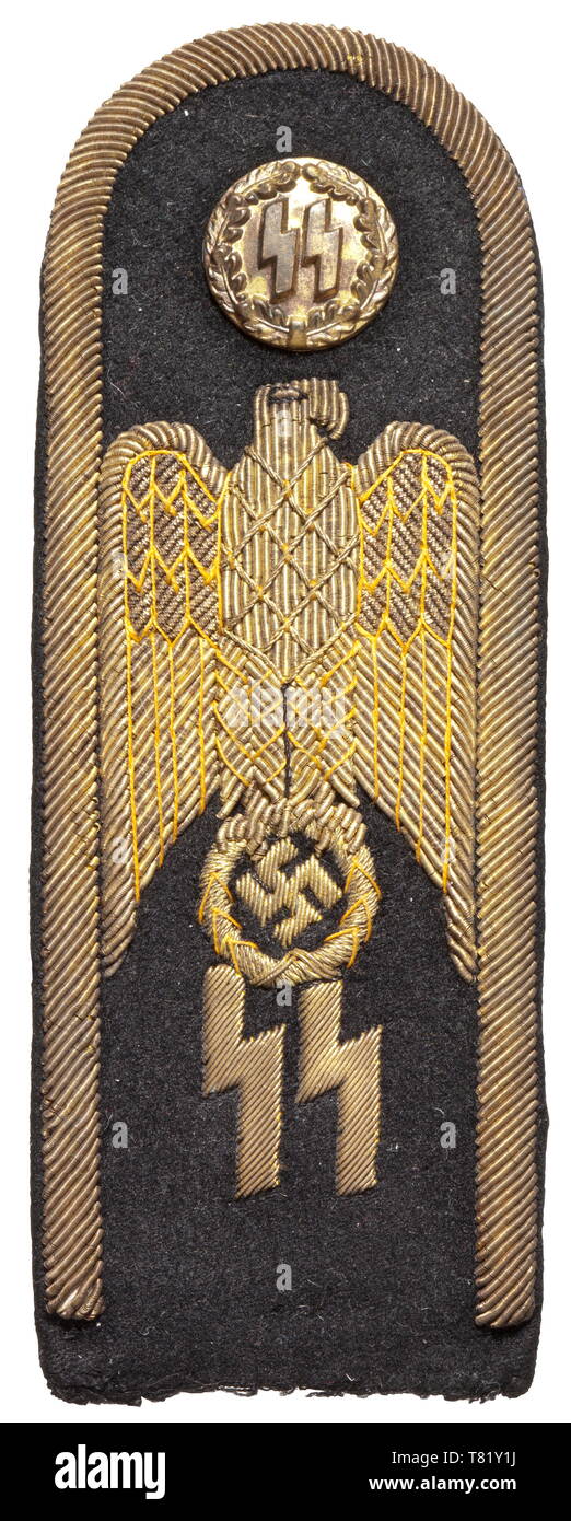 A trial shoulder board for a designed formal dress uniform for senior SS leaders of fine black cloth with gold-embroidered edging and national eagle above SS runes, black wool liner. One-piece stamped gold button with SS runes in relief within an oak leaf wreath. Slightly darkened. Included is a copy of an invoice from 1971. Presumably a unique trial piece. historic, historical, 20th century, troop, troops, SS, Schutzstaffel, Editorial-Use-Only Stock Photo