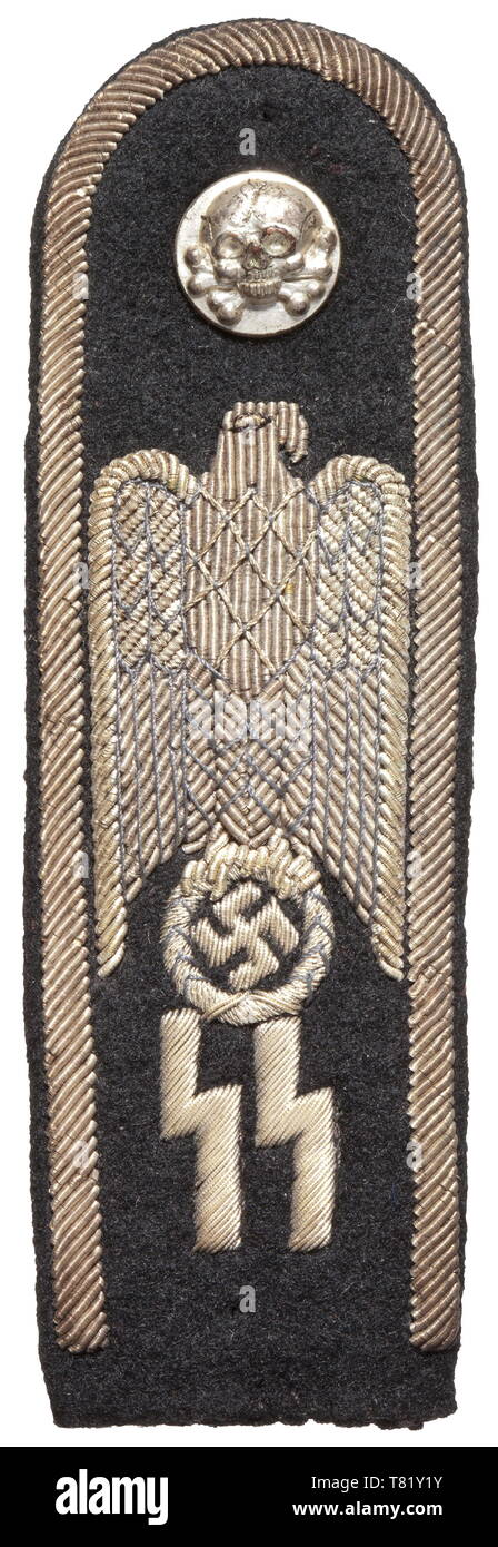 A trial shoulder board for a designed formal dress uniform for SS leaders of fine black cloth with silver-embroidered edging and national eagle above SS runes, black wool liner. One-piece stamped silver button with a death's head in relief. Slightly darkened. Included is a copy of an invoice from 1971. Presumably a unique trial piece. historic, historical, 20th century, troop, troops, SS, Schutzstaffel, Editorial-Use-Only Stock Photo