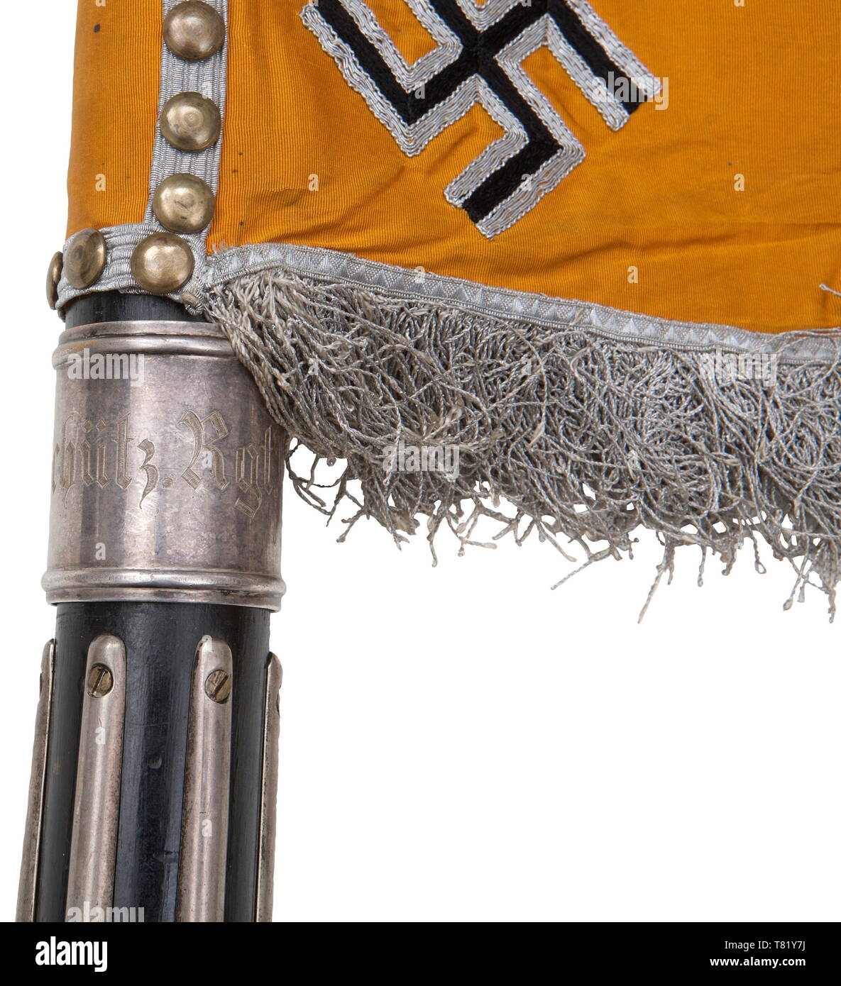 A standard of the 1st Battalion of the 6th Schützen Cavalry Regiment. Bright yellow/orange coloured silk cloth. Obverse and reverse hand-embroidered black army eagle with its feathers set off in brown. Beak and talons rendered in raised gold embroidery, on a field of cream-coloured silk, surrounded by an embroidered silver oak leaf wreath on an Iron Cross. Four applied swastikas in the corners. Silver fringe on three sides. Dimensions ca. 51 x 69 cm (without pole sleeve). 46 attachment nails (worn by polishing), backed by silver tress. Black poli, Additional-Rights-Clearance-Info-Not-Available Stock Photo