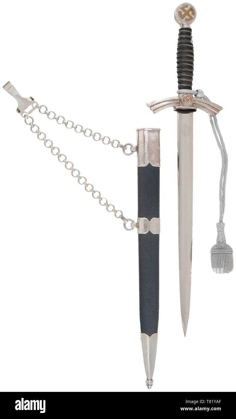A flyer's dagger M 35, (so-called 'Borddolch') with sword knot and hanger. Maker Paul Weyersburg, Solingen. The blade etched with manufacturer's trademark, the silvered pommel and cross-guard, brass sun wheel swastika. Dark-blue leather grip with wire wrap. Dark-blue leather-covered scabbard with silvered fittings and chain hanger. Silver sword knot. Length 50 cm. A very well preserved 'Borddolch'. USA-lot historic, historical, Air Force, branch of service, branches of service, armed service, armed services, military, militaria, air forces, object, objects, stills, clipping, Editorial-Use-Only Stock Photo
