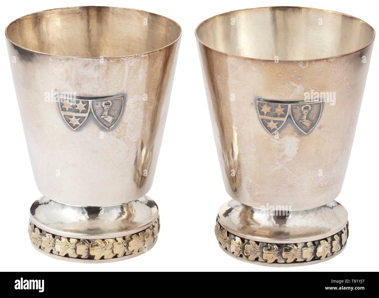 Hermann and Emmy Göring - two silver drinking beakers from their personal table service. Heavy wrought issue, the lower edges with a continuous frieze of oak leaves in relief, the viewing surfaces with an applied alliance coat of arms. The bottom with the master's mark of Prof. Herbert Zeitner, Berlin, Göring's preferred gold- and silversmith. Fineness 925. Height 11 cm. Weight 285 g and 305 g. Eminently beautiful, heavy silversmith work. Provenance: Keith Wilson Collection, Kansas City. historic, historical, 20th century, 1930s, NS, National Socialism, Nazism, Third Reich,, Editorial-Use-Only Stock Photo