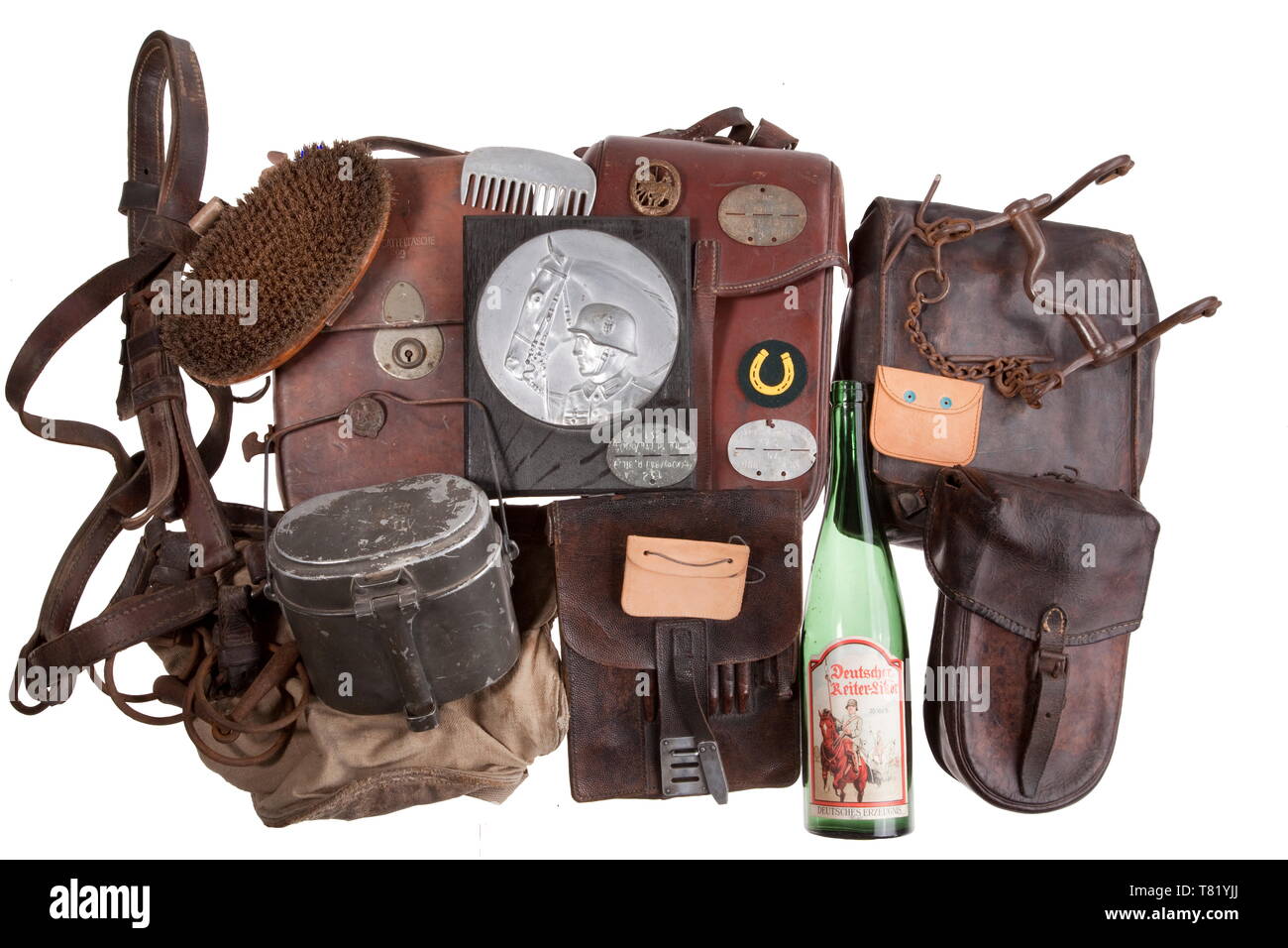 Cavalry accessories, equipment. Veterinary saddle bag M 29 of brown leather, with manufacturer's mark 'Hauptner' and other stampings. Also a saddle bag M 34 stamped 'J. M. Eckart, Ulm 1939' and 'GA'. Also included is a map-case M 35, a further map-case with accessories, a blacksmith's bag with files, a canvas feeding trough, a horse brush, three identity discs for cavalry, a Youth Sports Badge for Riding, a patch for horseshoeing personnel, a bridle with bit, a Driver's Badge (post-war), a mural relief and other accessories. Not checked for compl, Additional-Rights-Clearance-Info-Not-Available Stock Photo