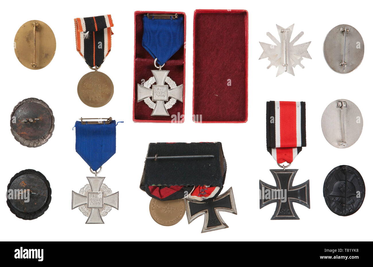 A collection of awards. 1938 25 years Faithful Service Cross in case, 1938 25 years Faithful Service Cross in Silver, 1st Type Black and Silver Wound Badge, 2nd Type Black, Gold and two Silver Wound Badge's, 2 Place Medal Bar ( EK II & Oct 1938 occupation), 1939 War Merit Cross with Swords 1st Class, 1939 Iron Cross 2nd Class, and 1939 War Merit Medal. USA-lot historic, historical, awards, award, German Reich, Third Reich, Nazi era, National Socialism, object, objects, stills, medal, decoration, medals, decorations, clipping, cut out, cut-out, cut-outs, honor, honour, Natio, Editorial-Use-Only Stock Photo
