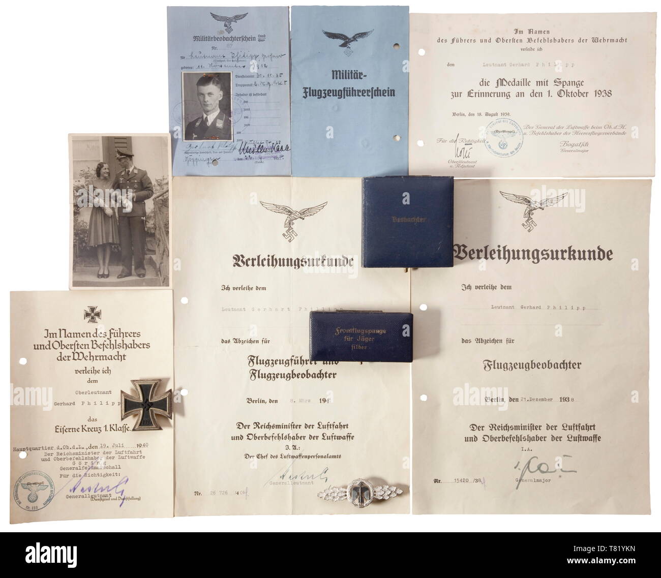 Group Captain Gerhard Philipp - III./JG 26 'Schlageter'. A Squadron Clasp for Fighter Pilots in Silver (swastika ground), cased, an Iron Cross 1st Class of 1939 of maker 'L/12' with award document dated 19 July 1940, document for the Aerial Observer's Badge 1938 with blue award case for the decoration, award document for the Combined Pilot/Observer's Badge 1940, document for the Commemorative Medal of 1 October 1938 (Sudetenland) and an appointment to Lieutenant. Also an exoneration letter for his friend Captain 'Pips' Priller regarding the alleged shooting of English pilot, Editorial-Use-Only Stock Photo