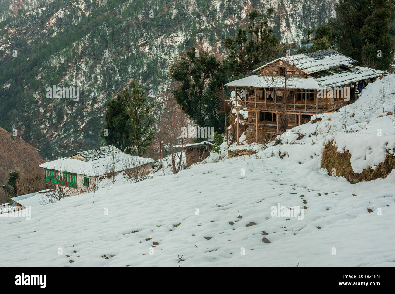 Snow covered wooden house in mountains - Majestic winter landscape in ...