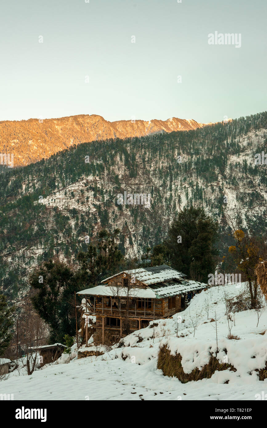 Snow covered wooden house in mountains - Majestic winter landscape in ...