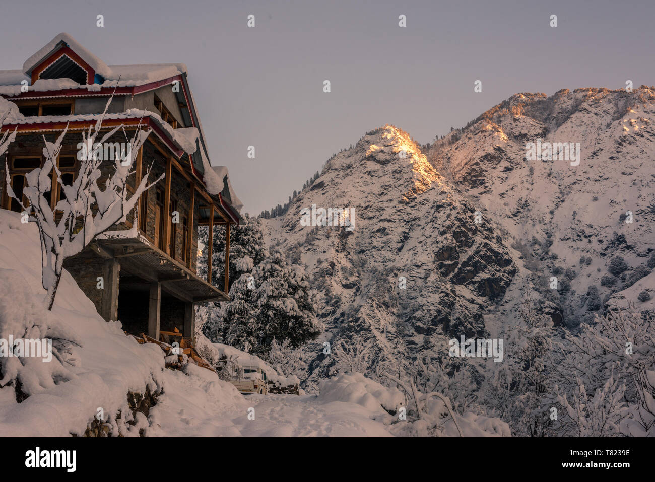 Snow covered wooden house in mountains - Majestic winter landscape in ...