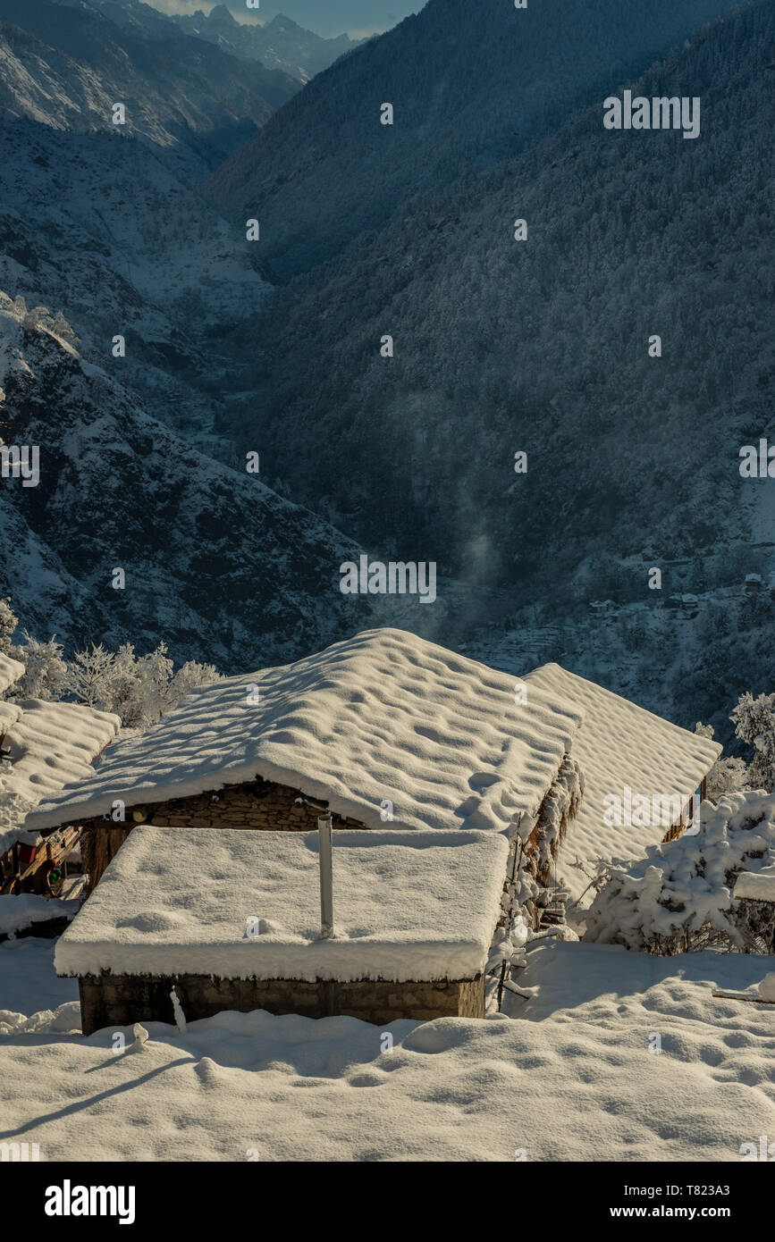 Snow covered wooden house in mountains - Majestic winter landscape in ...