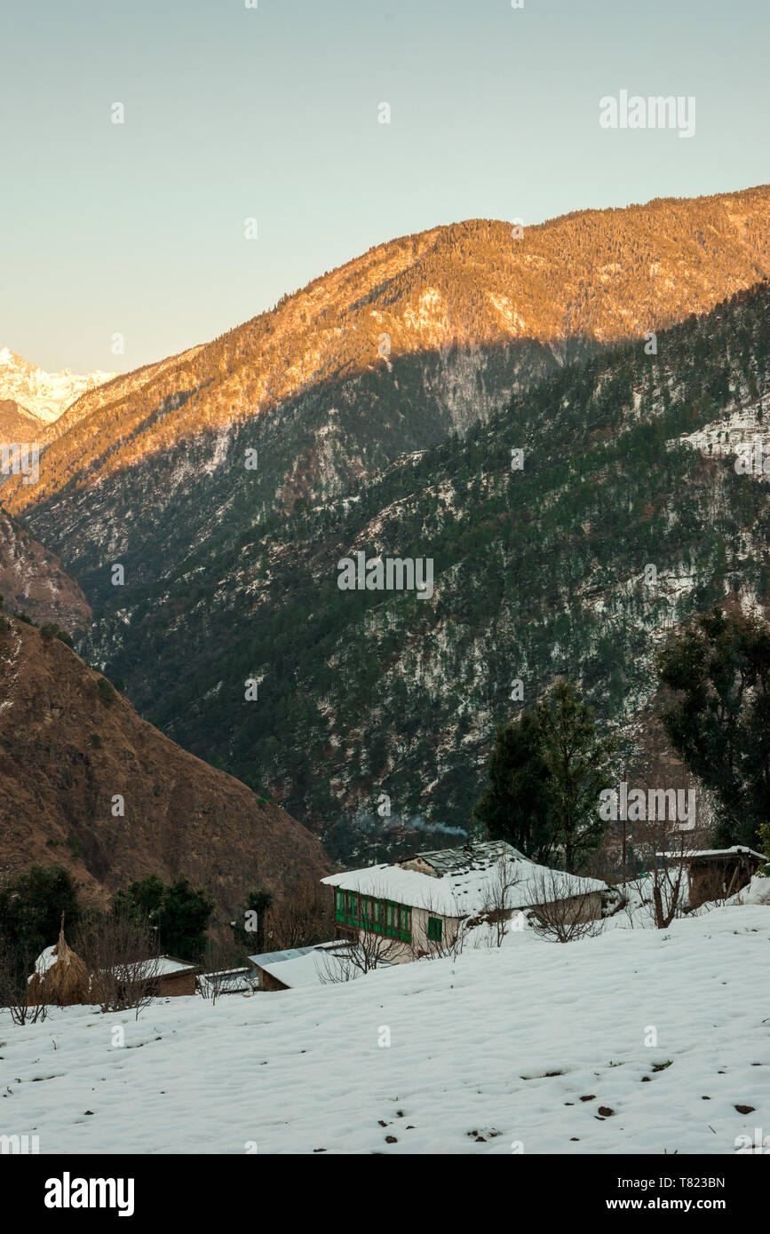 Snow covered wooden house in mountains - Majestic winter landscape in ...