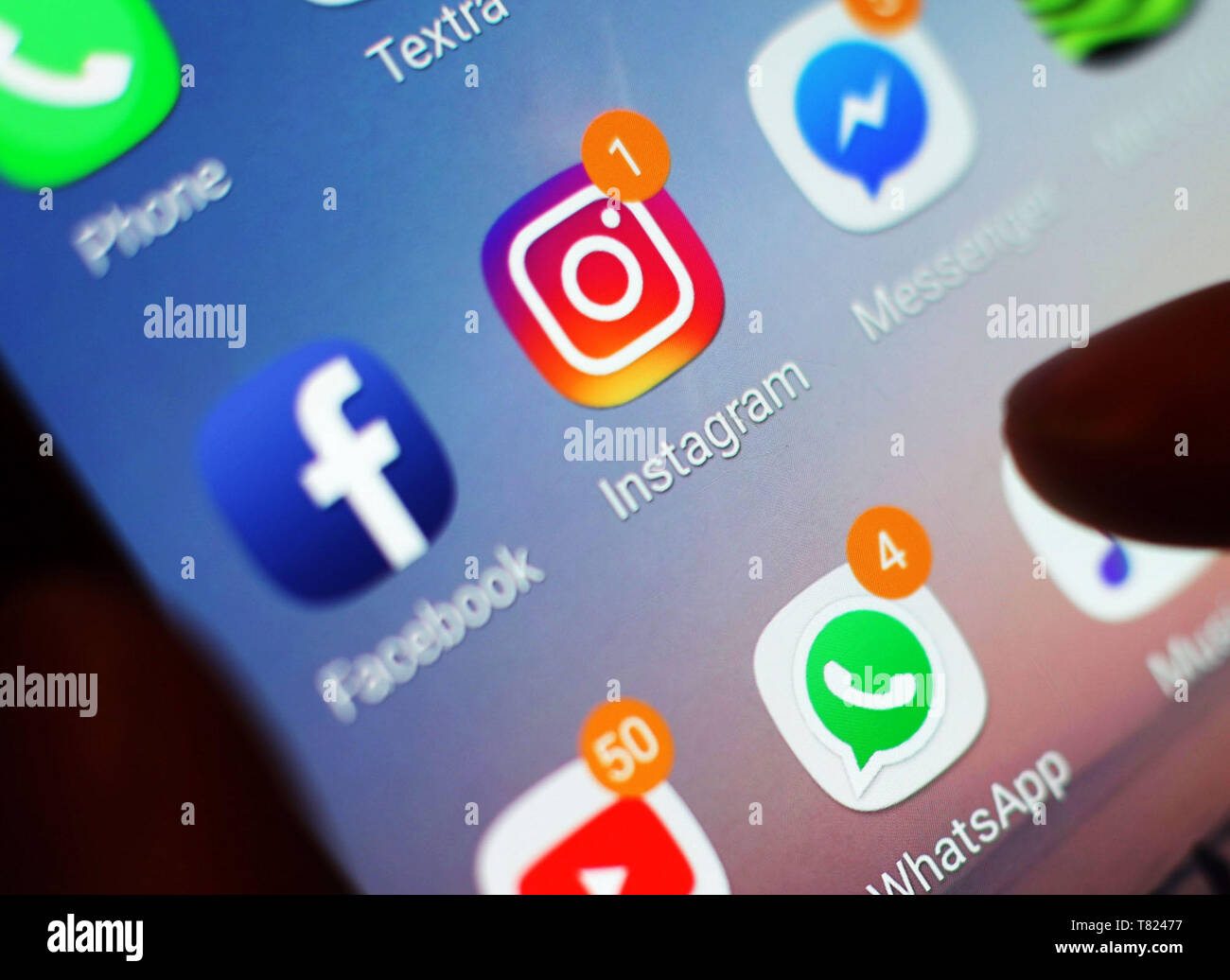 of the Instagram and Facebook icons displayed on a mobile phone screen. Instagram is cracking down on misinformation about vaccinations being spread across the photo sharing app by blocking hashtags that draw out 'verifiably false' posts about the controversial subject. Stock Photo