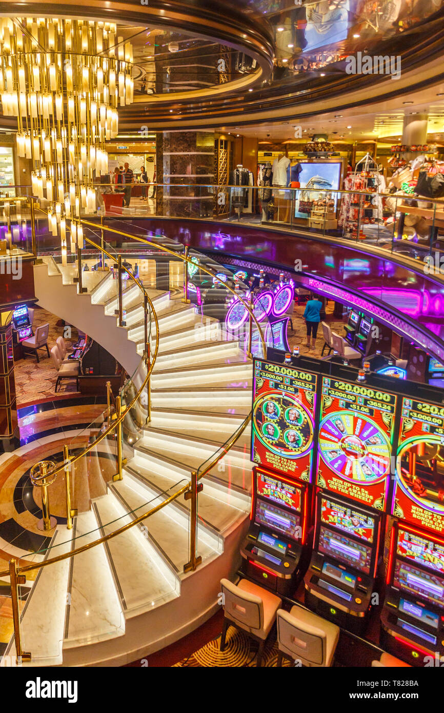 Civitavecchia, Italy - 20th September 2017: Staircase, shops and gaming machines in the Atrium on Royal Princess cruise ship. Most ships feature casin Stock Photo