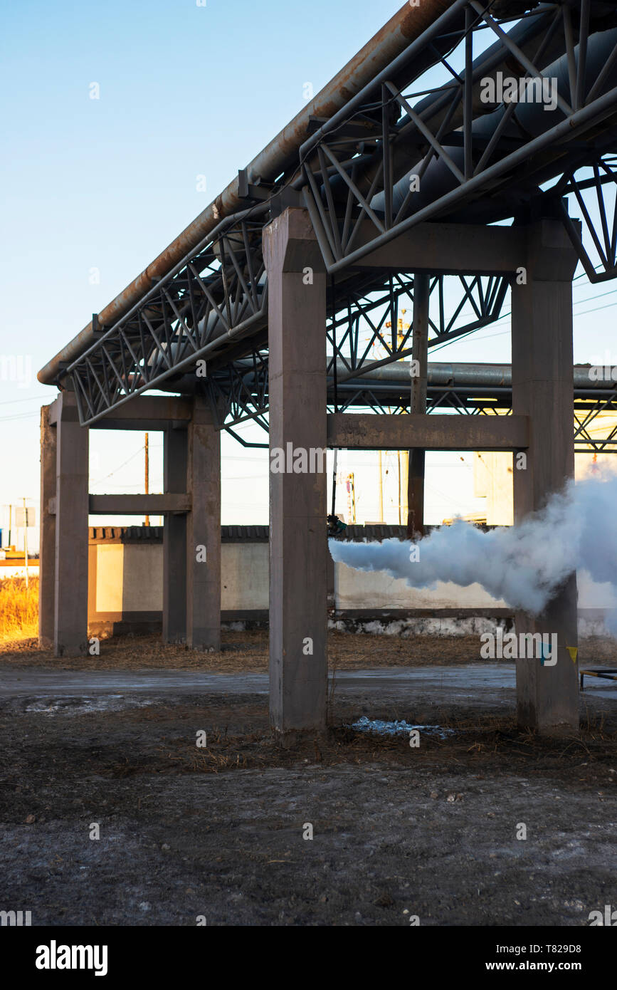 Spray steam from the reducing valve in the winter Stock Photo