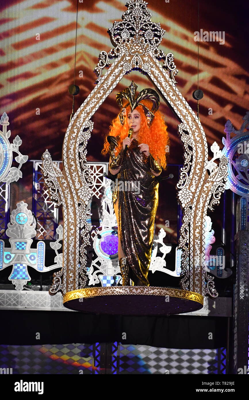 Cher is shown performing on stage during a live concert appearance