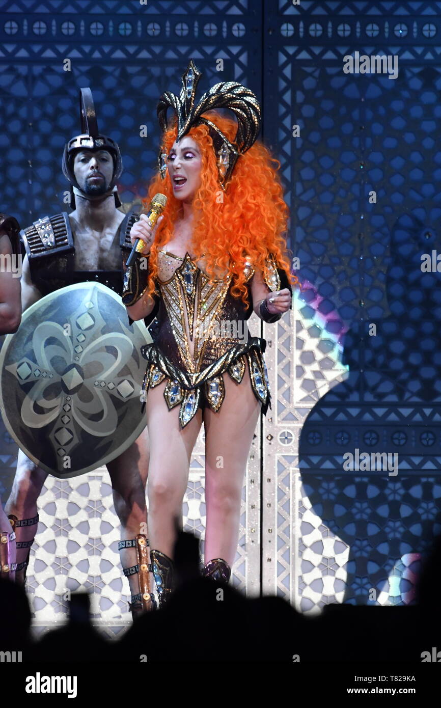 Cher is shown performing on stage during a live concert appearance. Stock Photo