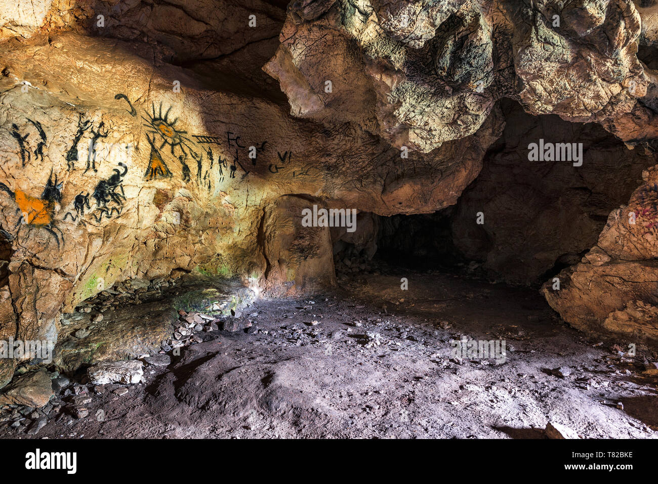 Drawing of an ancient Stone Age man in a cave. Prehistoric painting Stock  Photo - Alamy