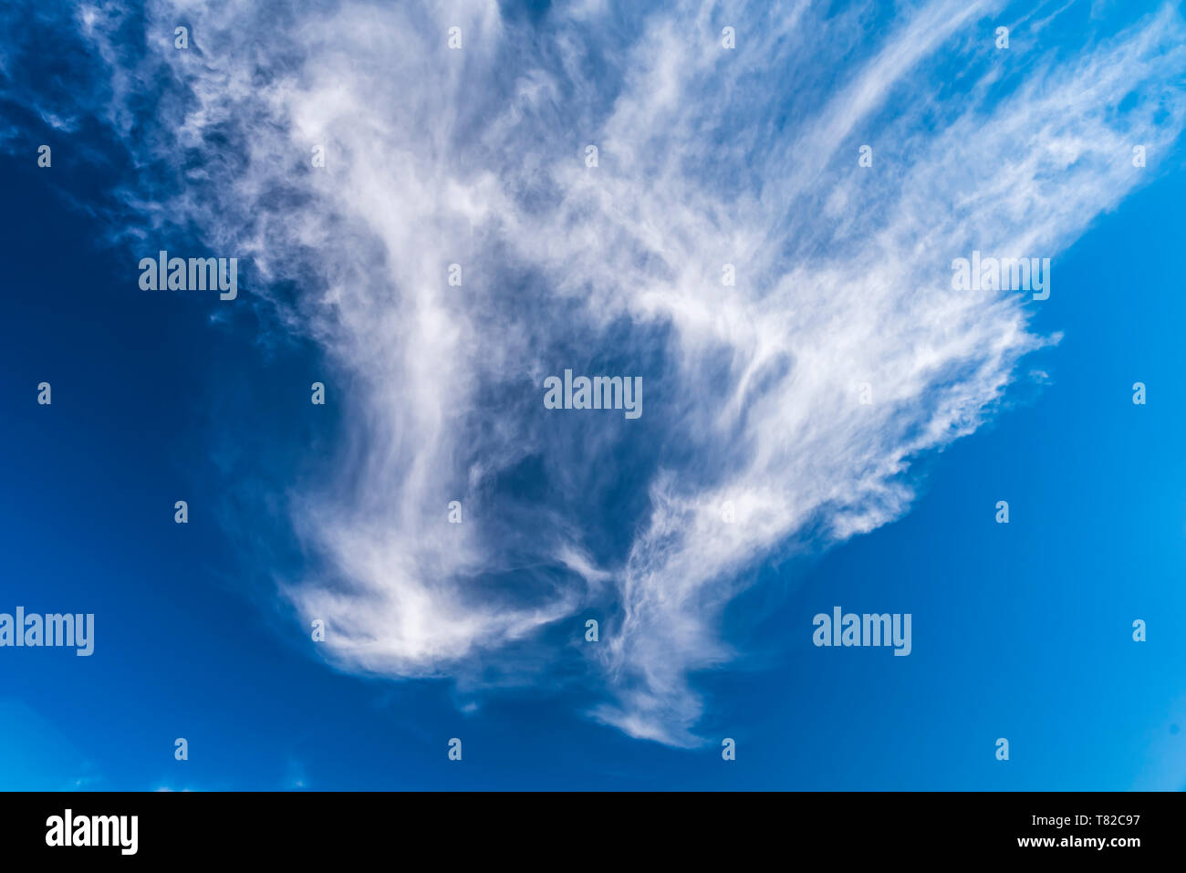White puffy clouds on blue sky Stock Photo Alamy