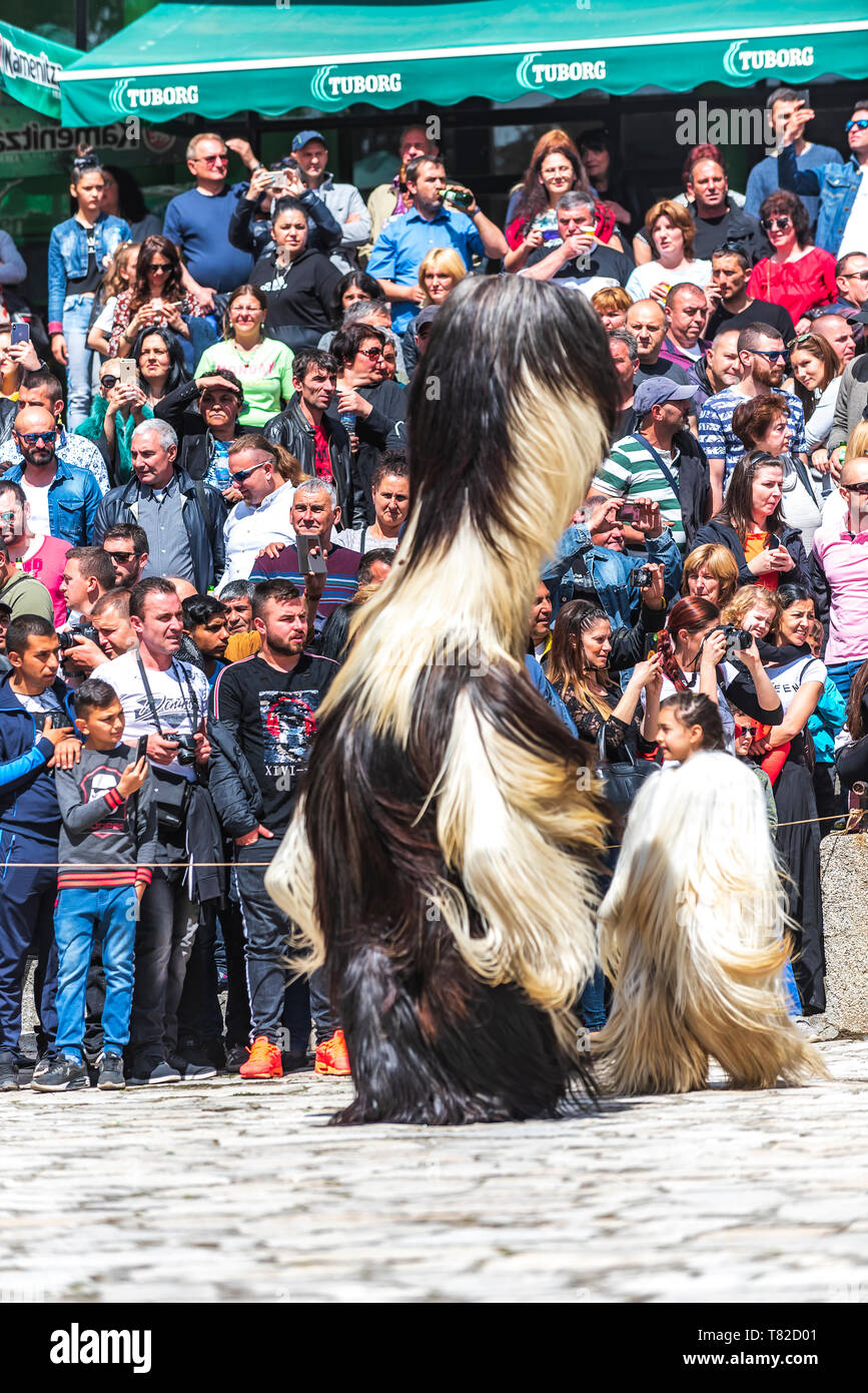 Eleshnitsa, Bulgaria - April 28 2019: Moment from National Festival during Easter,  presents traditions of Bulgarian Kuker Games. Stock Photo