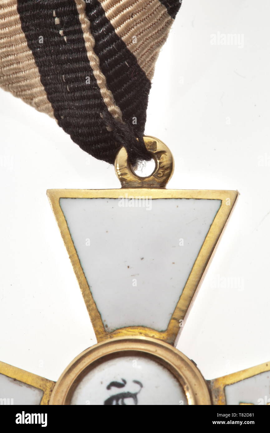 A Russian Order of St. George, 4th Class Cross for 25 years of Service. Mid-19th century. Gold, enamelled, in the eyelet St. Petersburg fineness mark for '56' zolotniki next to an illegible maker's mark. Dimensions ca. 38 x 34 mm, weight 8 g. With original ribbon. In good condition. Rare. Provenance: Major General Georgy Georgievich Emmanuel (1815 - 1868). historic, historical, medal, decoration, medals, decorations, badge of honour, badge of honor, badges of honour, badges of honor, 19th century, Additional-Rights-Clearance-Info-Not-Available Stock Photo