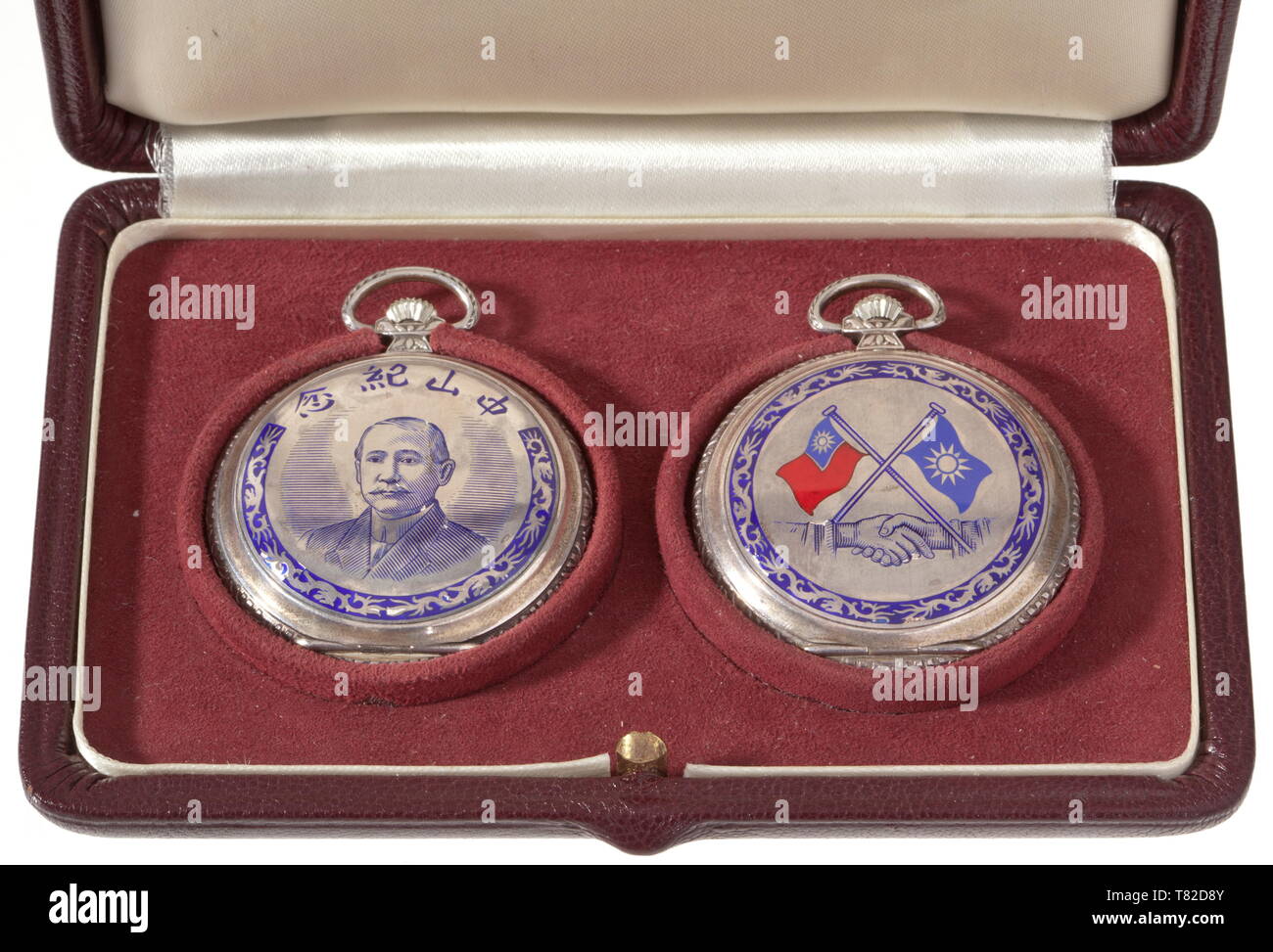 Walter Stennes (1895 - 1989) - Ernst Ramm. Two presentation pocket watches from the Koumintang military advisor to the head of the German consulate. The watches made of silver. The hunter cases inlaid with enamel and portraits of Chaing Kai-Shek, a motto scroll, and dragon decoration (minimal damage to the enamel on both watches). The back covers inlaid with enamel flags of the Koumintang and the Republic of China. The inside of the covers with manufacturer's inscription 'Magno', '925', and various hallmarks. Chinese characters on the enamel dials. In the presentation case., Editorial-Use-Only Stock Photo