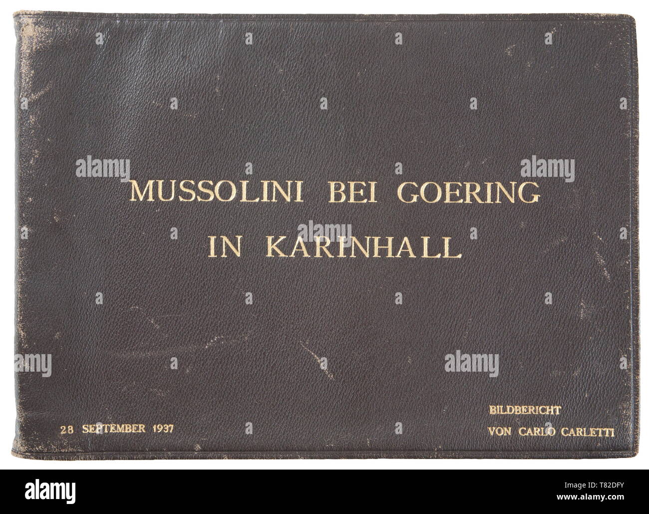 Hermann Göring - A photo album of Mussolini's official visit to Carinhall Large format photo album (34 x 24 cm) with brown leather cover with gold-embossed "MUSSOLINI BEI GOERING IN KARINHALL", "28 SEPTEMBER 1937" and "BILDBERICHT VON CARLO CARLETTI". Album consists of eighteen 17 x 23 cm black and white photos. Photos are of a casual/informal style and feature Hermann Göring, Emma Göring, Mussolini, Count Ciano, Achille Starace, Luftwaffe Generals Milch, Stumpf, and Bodenschatz, Paul Schmidt, SS General Dietrich, and more. From the possession of a US officer of the 101st A, Editorial-Use-Only Stock Photo