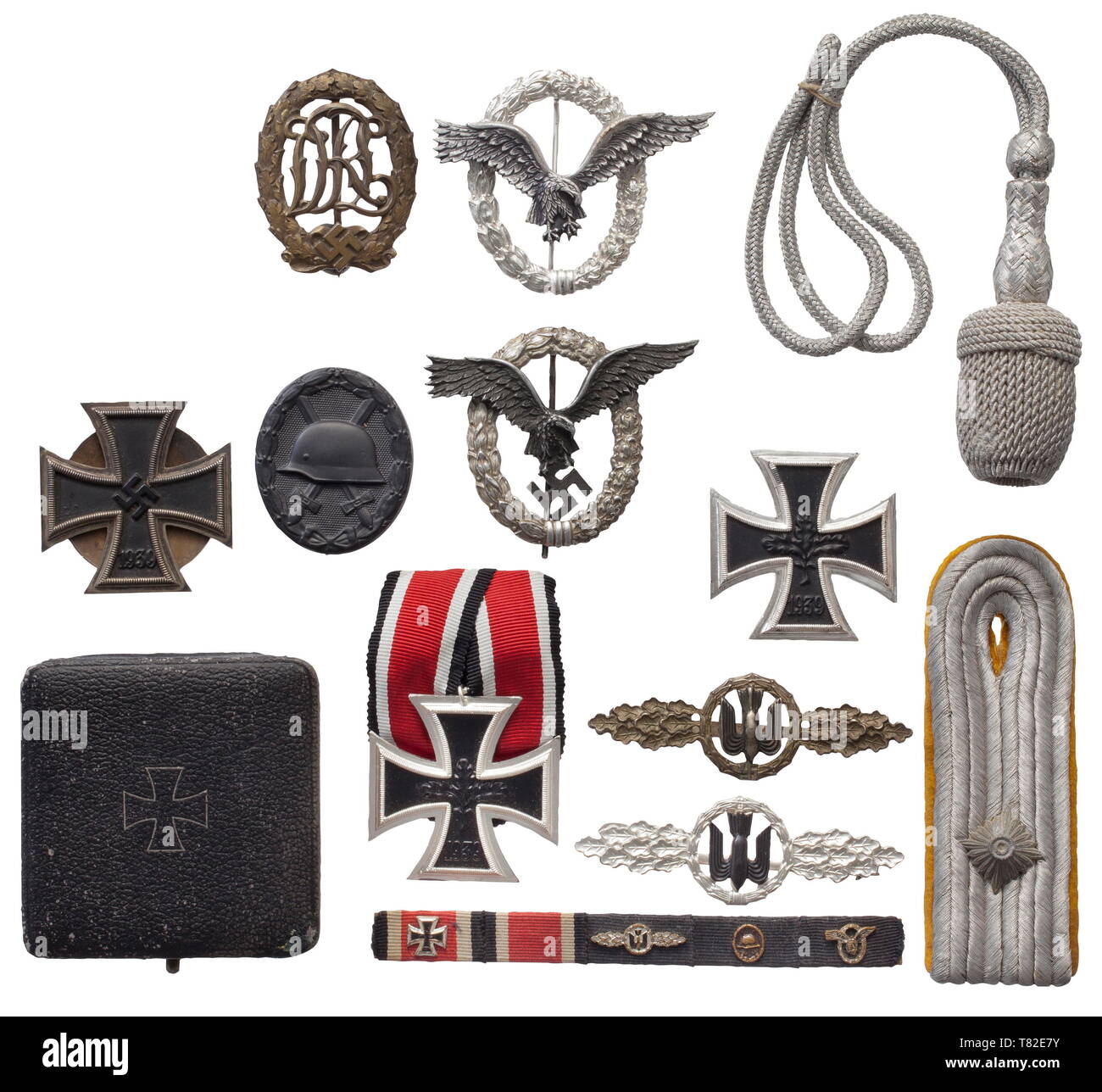 The estate of a Luftwaffe officer A Pilot's Badge in aluminium issue (rare), a Squadron Clasp for Bomber Pilots in Bronze, an Iron Cross 1st Class with threaded disc attachment, a case for an EK 1 and a Reich Sports Badge. Included is a field orders clasp in 1957 issue with all corresponding decorations. Also, a shoulder board for an Oberleutnant and a sword knot for the Luftwaffe dagger. In addition, two uniform jackets for an Oberstleutnant in the Bundeswehr of Luftwaffe blue cloth with silk liners and silver-embroidered cuff titles as well as the matching trousers. histo, Editorial-Use-Only Stock Photo