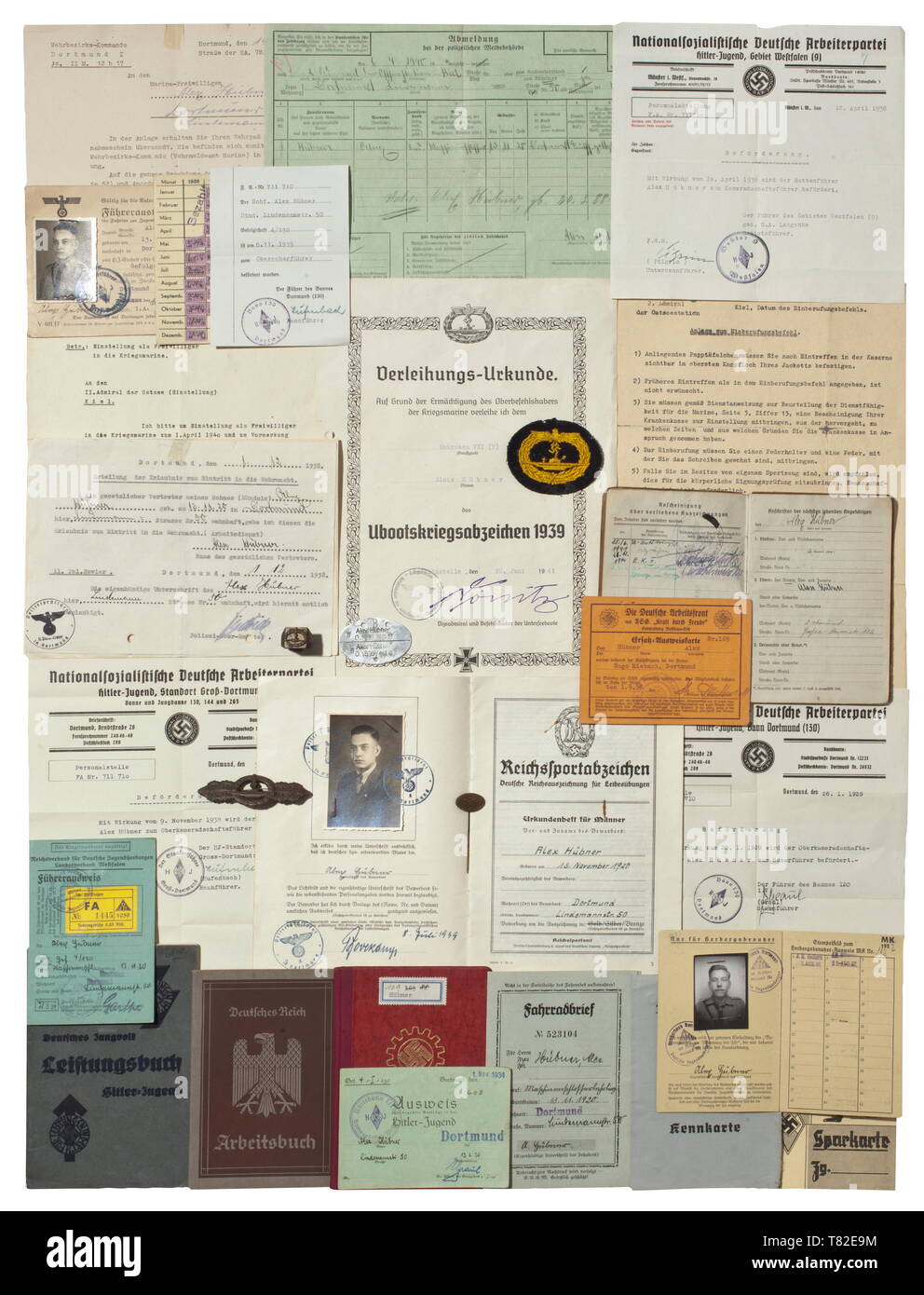 The estate of Petty Officer 2nd Class Alex Hübner, crew member of U-48, U-167 and U-775 Decorations, pay book and various documents. The pay book with photo id, issued on 11 August 1941 with numerous entries such as awards (U-Boat War Badge, U-Boat Combat Clasp, Iron Cross 2nd Class), promotions and assignment changes with various U-Boat flotillas. Also the award document for the U-Boat War Badge with facsimile signature of Dönitz issued on 26 June 1941 with incorrect first name (Alois) including a rare cloth version of the badge, the U-Boat Combat Clasp in Bronze with reve, Editorial-Use-Only Stock Photo