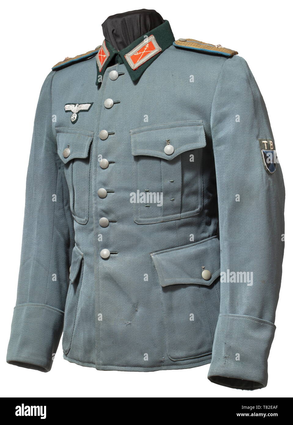 A uniform jacket for an officer of the Terek Cossacks The tunic of light grey cotton material of Dutch manufacture with hand-embroidered national eagle for officers, the collar patches and sleeve insignia hand-stitched. Shoulder boards of Russian pattern with an applied rank star, doubled gold-coloured lace on light blue cloth backing, looped. Green turn-down collar, partial silk inner liner, orders loops for two decorations. With traces of age and usage. Many former Russian army members enlisted in the Wehrmacht from prisoner of war camps, and from Eastern Europe many also, Editorial-Use-Only Stock Photo