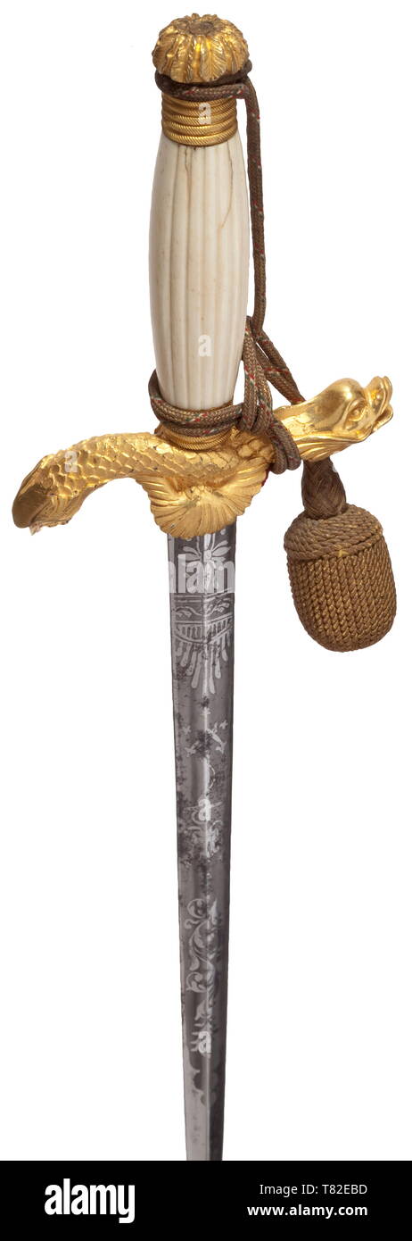 A splendid dagger of the Austrian navy Blade of triangular section (slightly stained), etched with ornaments, anchor and imperial crown. Ivory handle (cracks), fire-gilt quillons in the shape of two dolphins. The fire-gilt scabbard with profuse relief decoration, anchor, imperial crown, paddles and paddle steamer. Sword knot with green-white-red interweaves. Length 44.5 cm. In Erich Gabriel's book 'Die Seitenwaffen der österreichischen und österreichisch-ungarischen Kriegsmarine' an identical piece is presented as an unidentified Austrian navy dagger, the royal-imperial arm, Editorial-Use-Only Stock Photo