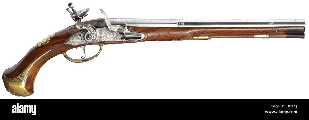 A flintlock pistol, Christoph Joseph Frey, Munich, circa 1730 Two-stage smooth bore barrel in 13 mm calibre, octagonal then round after a girdle. At the breech (replaced) brass inlays inscribed with 'FREY'. The flintlock chiselled with hunting themes and flowers, signed near the powder pan 'C. JOS. FREY IN MÜNCHEN'. Carved walnut stock (the forestock glued with replacements and a later horn nosepiece). Brass furniture with hunting themes in relief and openwork side plate, the pommel plate with antique bust, the escutcheon with engraved coat of ar, Additional-Rights-Clearance-Info-Not-Available Stock Photo