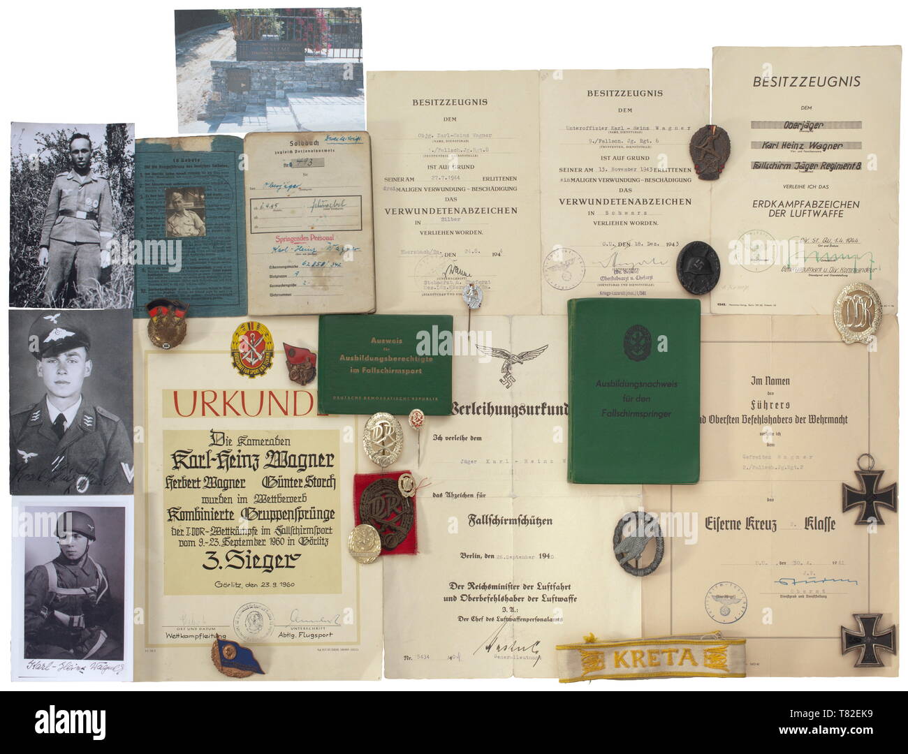 The estate of paratrooper Karl-Heinz Wagner Consisting of a Crete sleeveband (used, 43 cm in length), a Paratrooper's Badge in zinc (denazified, repaired), a Wound Badge in Black, an Iron Cross 2nd Class and an Iron Cross 1st Class (denazified) as well as various badges and pins from Wagner's time in the GDR. Also four decorations of his father (Honour Badge with document, EK II etc.), a pay book with the front denazified with photo in uniform and entries for awards (Paratrooper's Badge, EK I and EK II, Ground Combat Badge, Crete sleeveband, Clos, Additional-Rights-Clearance-Info-Not-Available Stock Photo