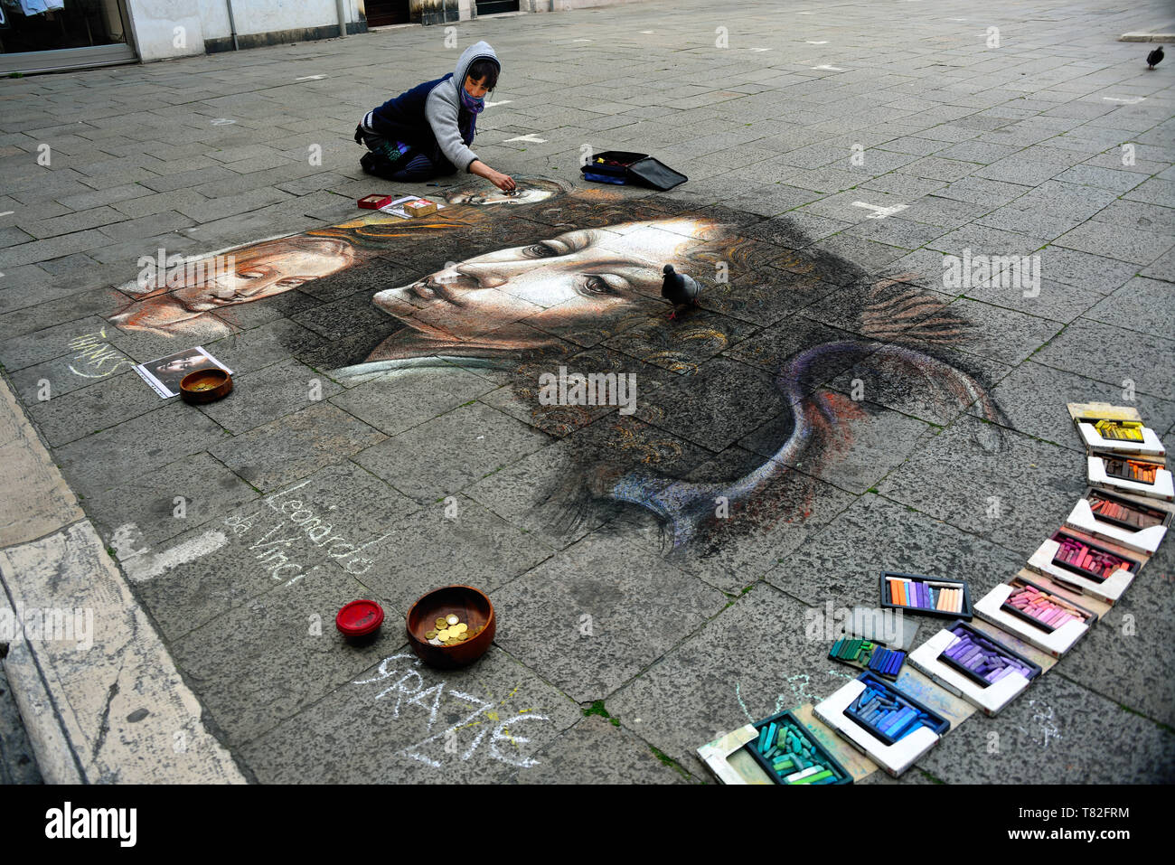 Venice, Italy. A street painter reproducing a picture by Leonardo da Vinci. Stock Photo