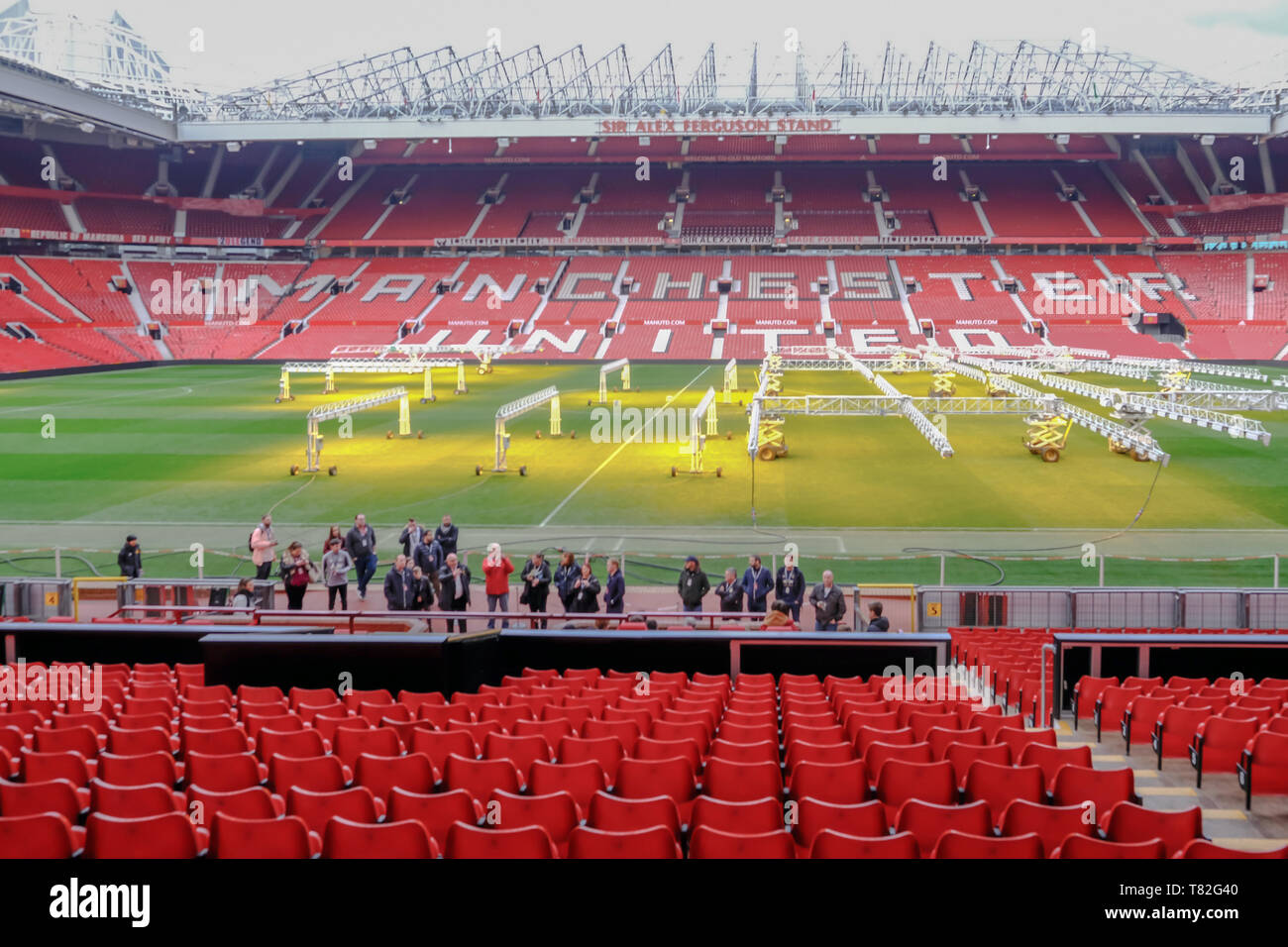 Old Trafford, Manchester, UK - January 20, 2019: Manchester United football stadium, looking at the Alex Ferguson Stand and shows a group of fans havi Stock Photo
