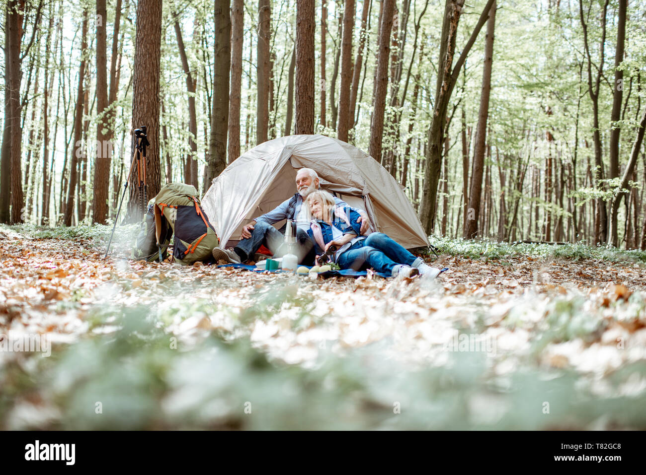 Smiling mature woman camping in hi-res stock photography and images - Alamy