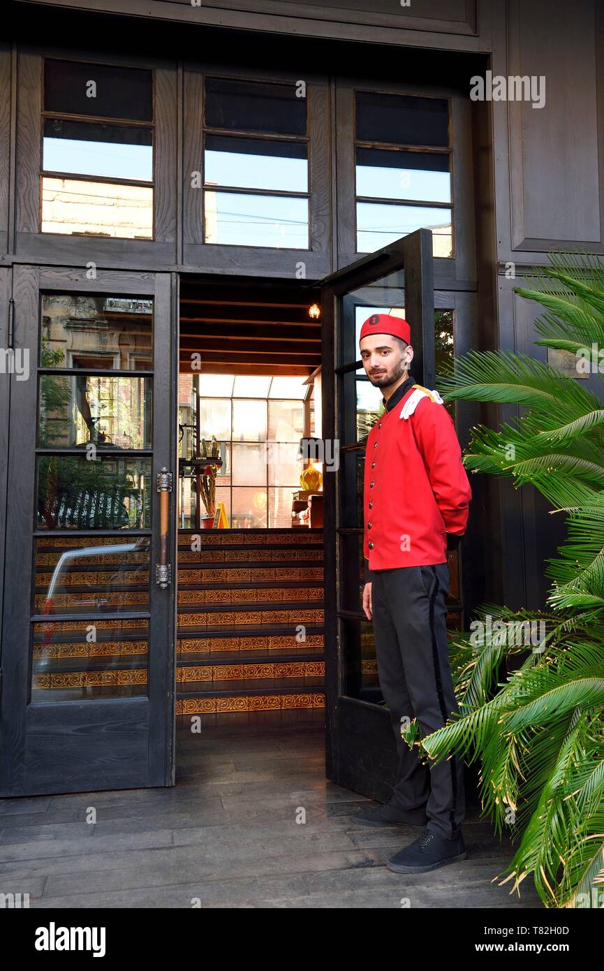 Georgia Tbilisi Bellboy At The Entrance Of The Rooms Hotel