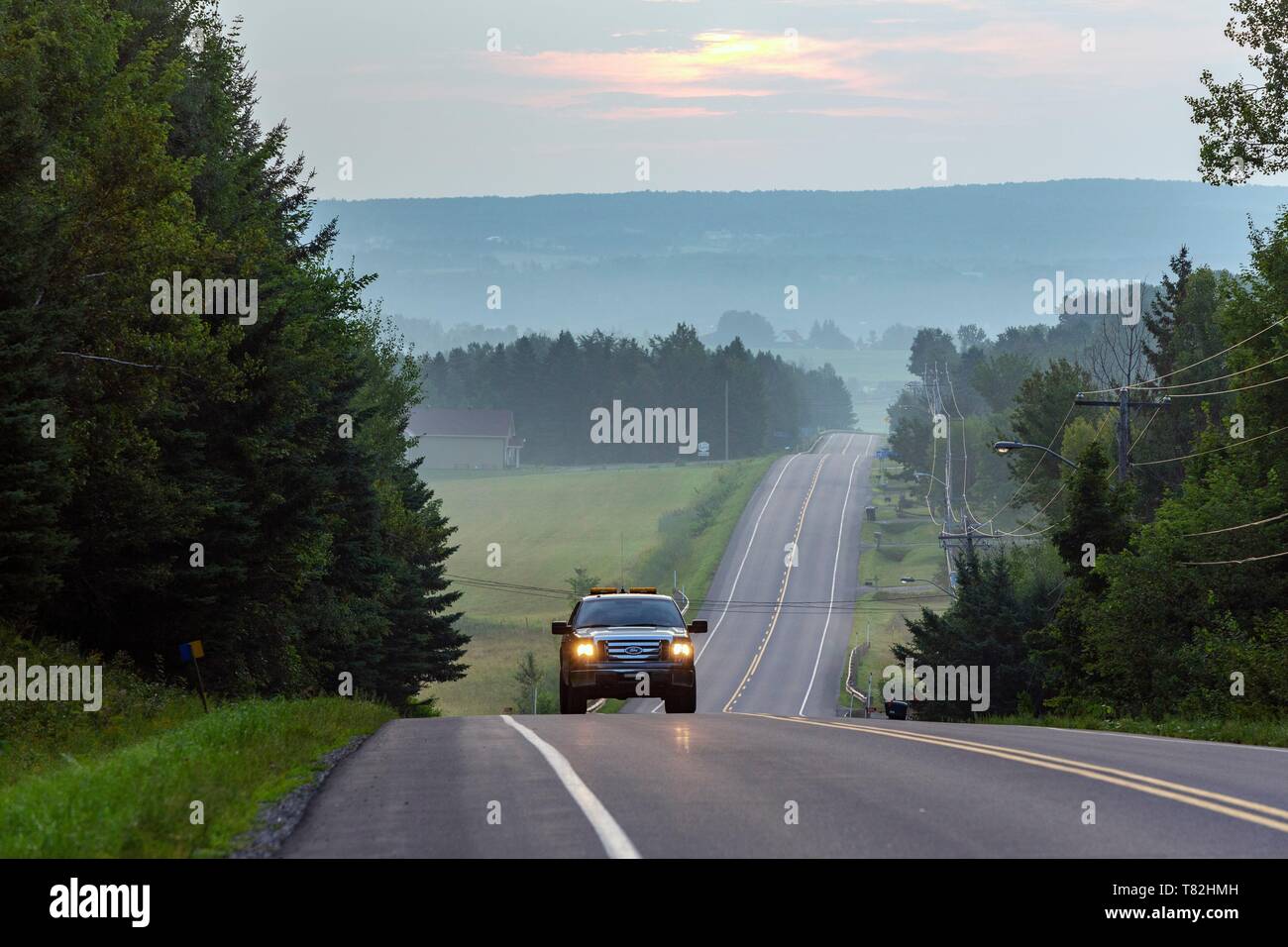 Canada, Province of Quebec, Eastern Townships Region or Estrie, Coaticook Road at Sunrise Stock Photo