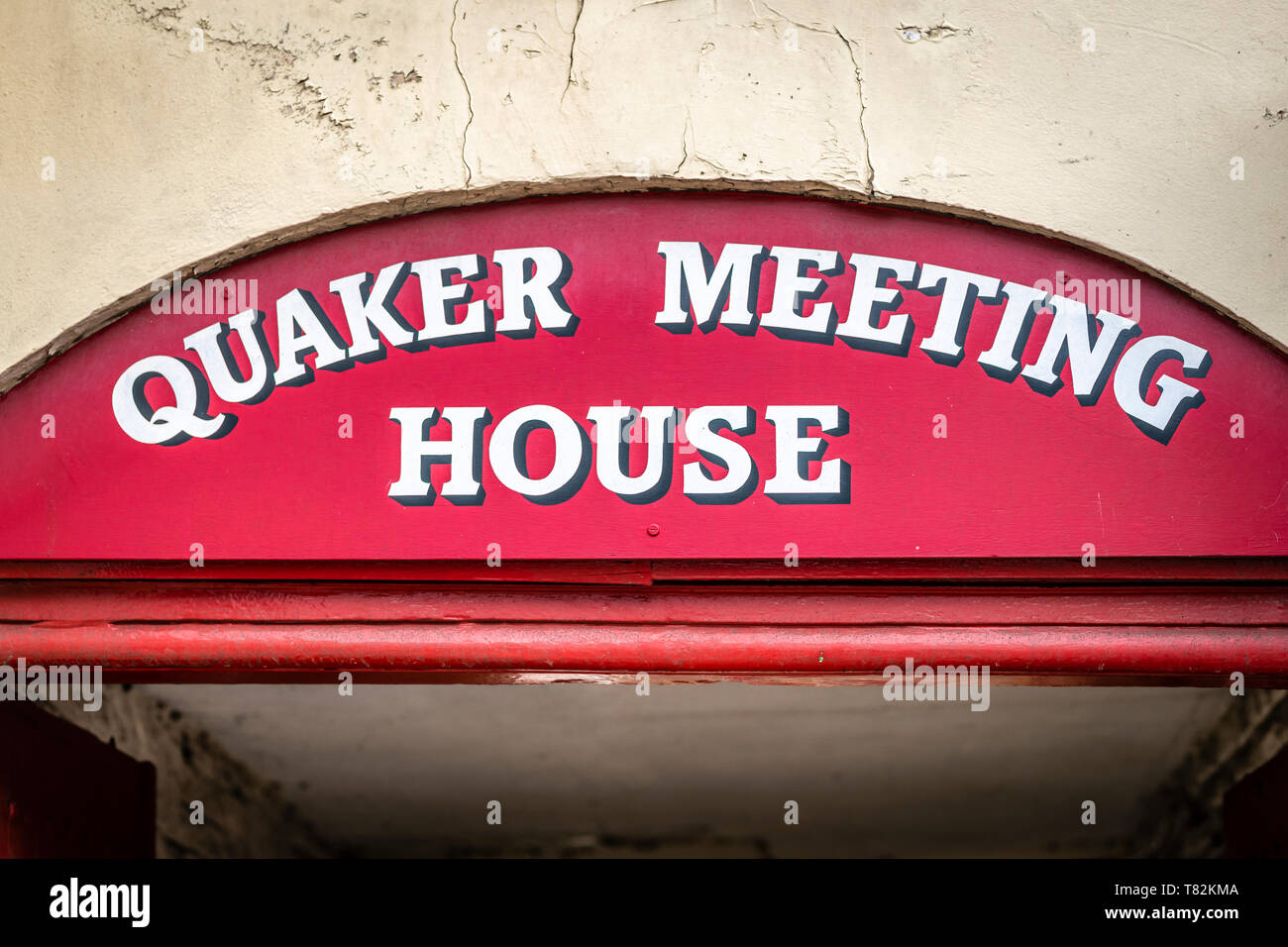 The sign above the entrance to the Quaker Meeting House in the High Street, Wellington, Somerset, England. Stock Photo