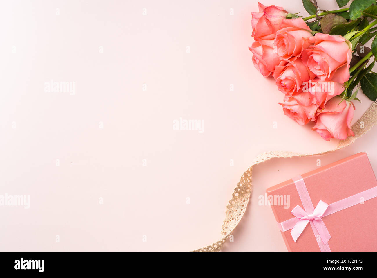 event design concept - top view of a bunch of pink rose , gift box and ...