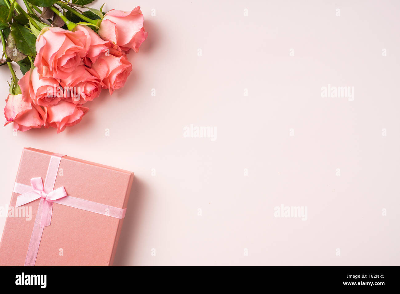 event design concept - top view of a bunch of pink rose , gift box on ...