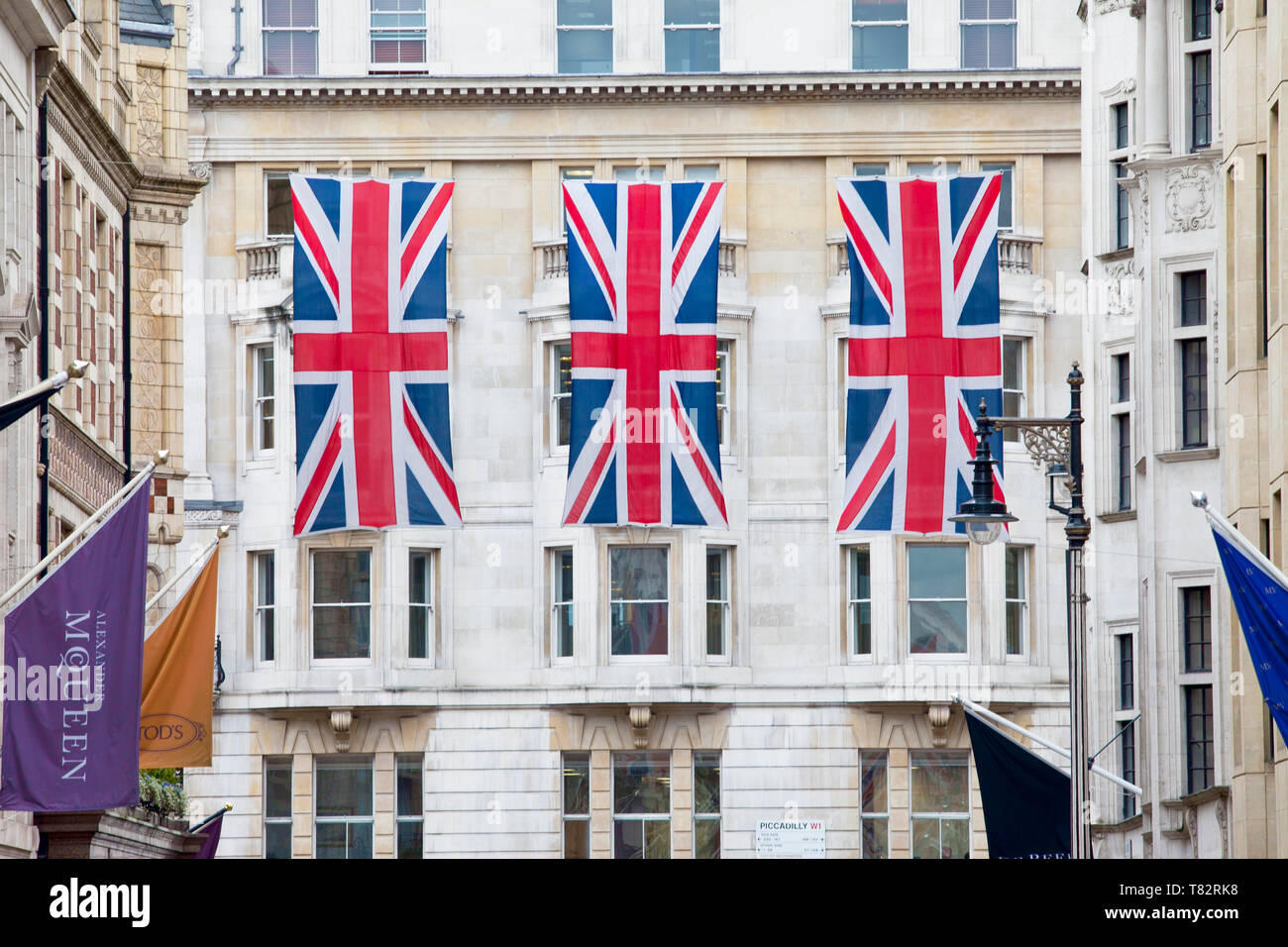 Union Jack flags hanging in London Street Stock Photo