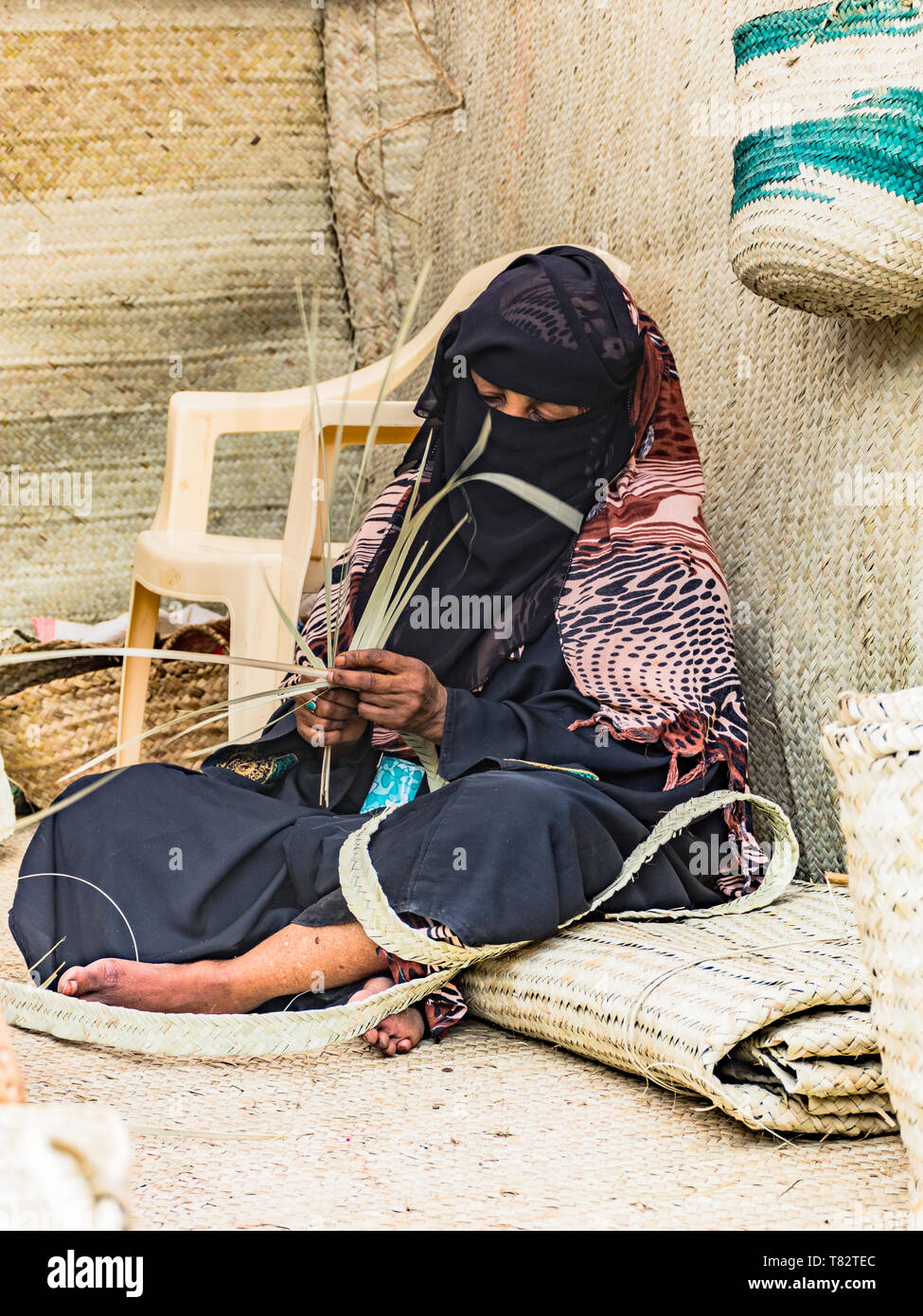 A Swahili Lady making Woven Mats Stock Photo