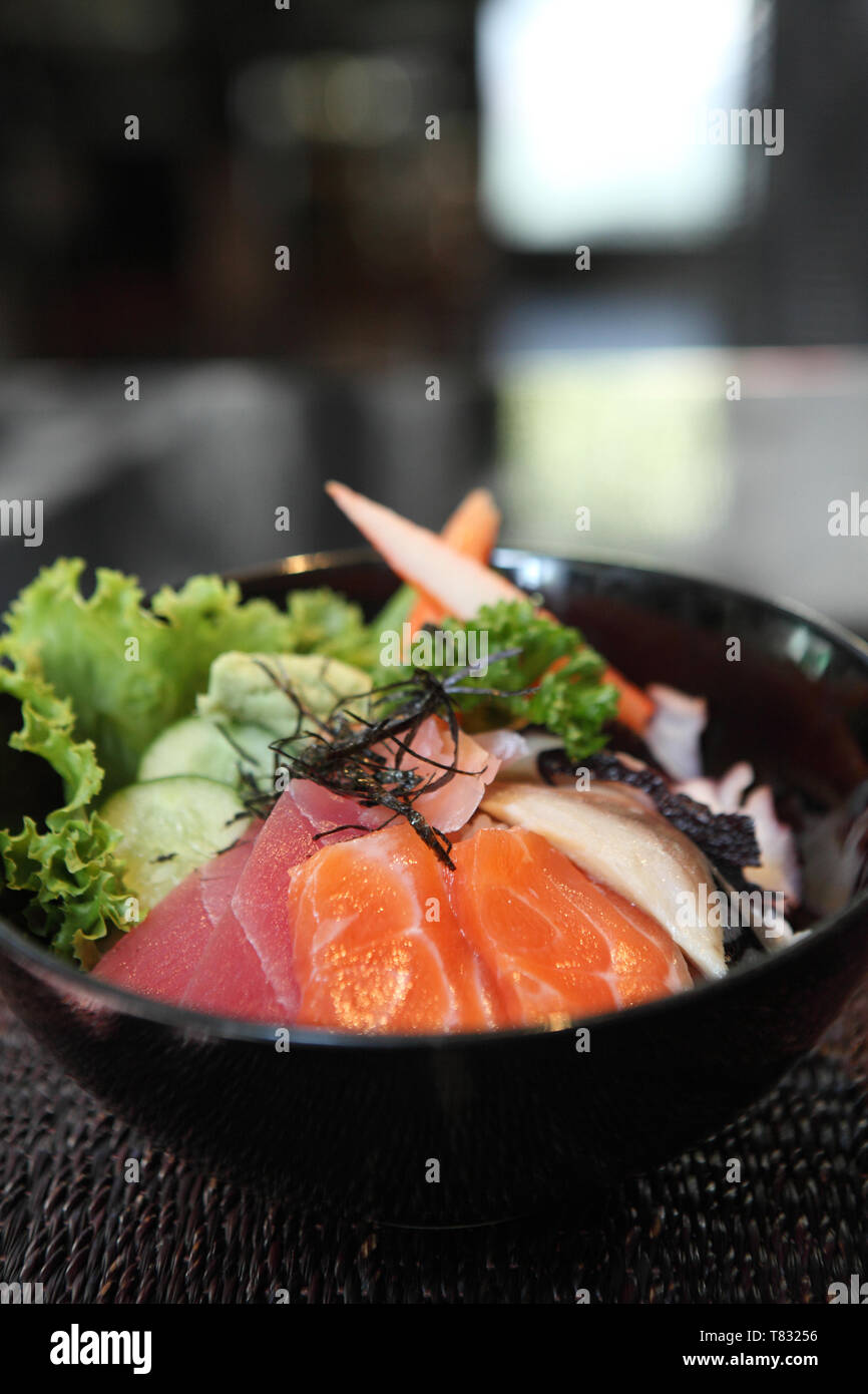 Sushi don , raw salmon tuna octopus on rice Stock Photo Alamy