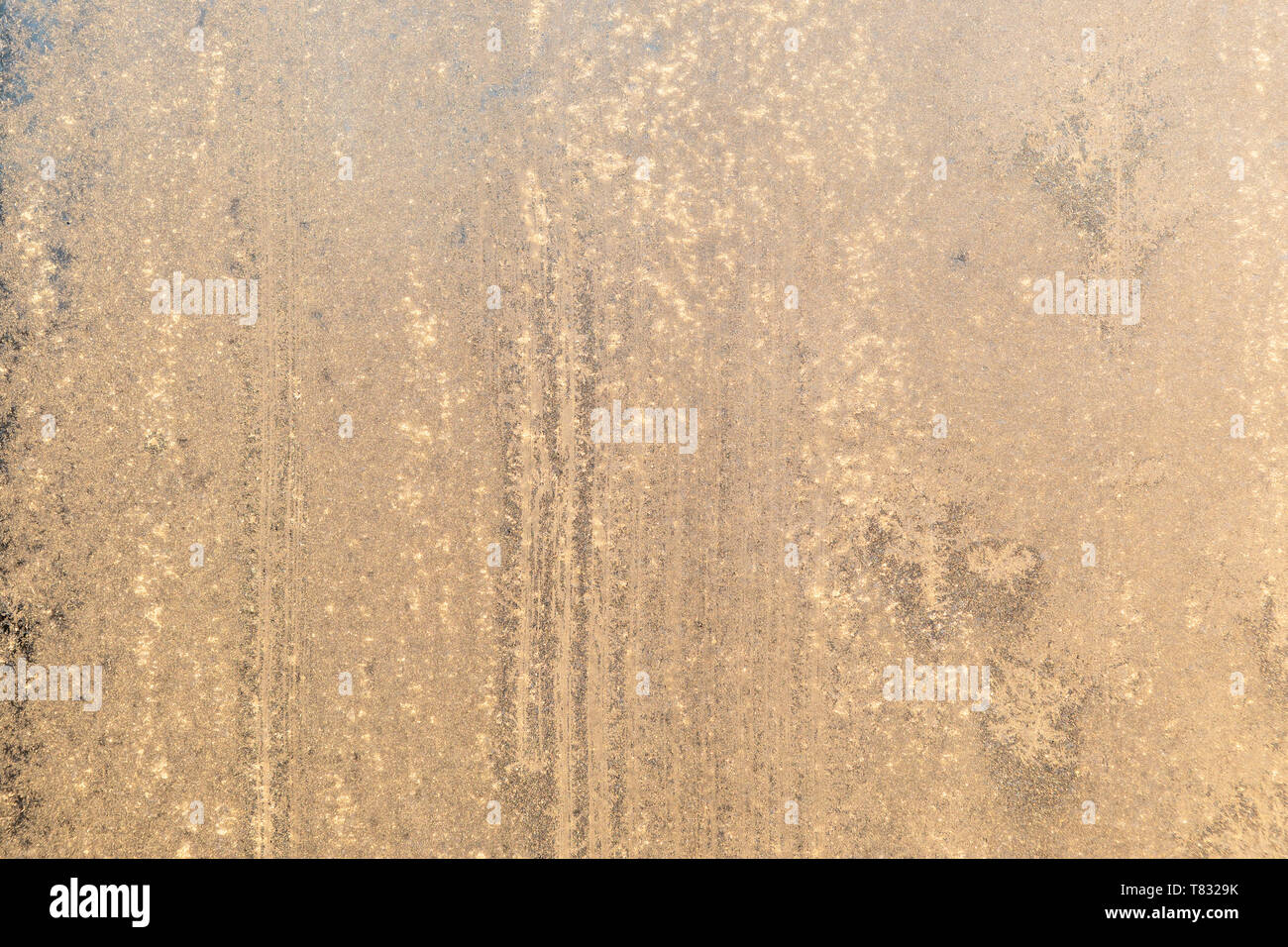 Frost in window at warm sunlight defocused Stock Photo