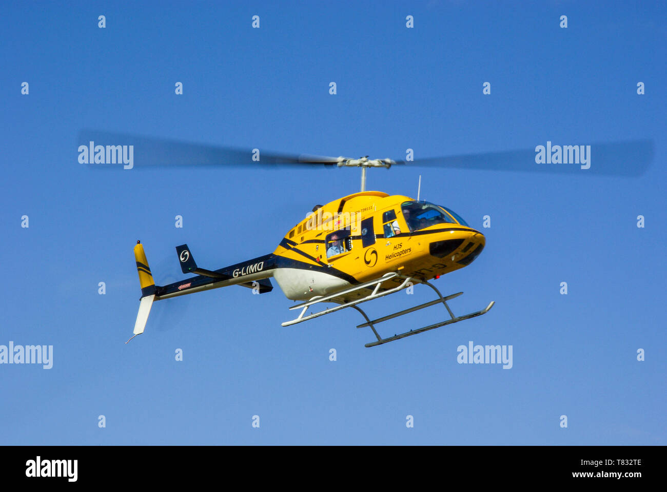 Bell 206 LongRanger G-LIMO helicopter of HJS Helicopters (Heliplayer Ltd) flying. Civilian transport helicopter used for charter and business travel Stock Photo