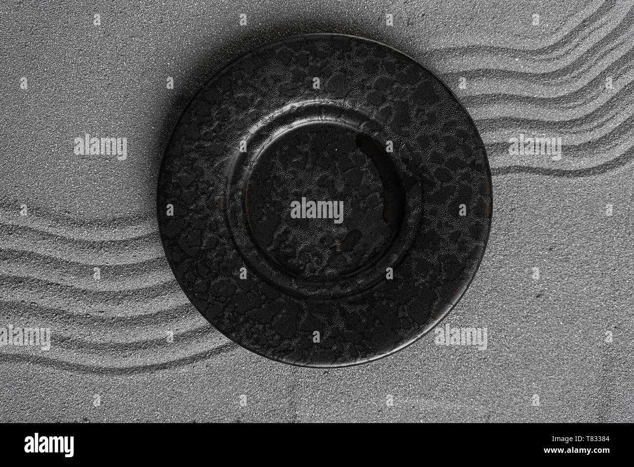 Empty black soup plate on dark grey background, top view Stock Photo